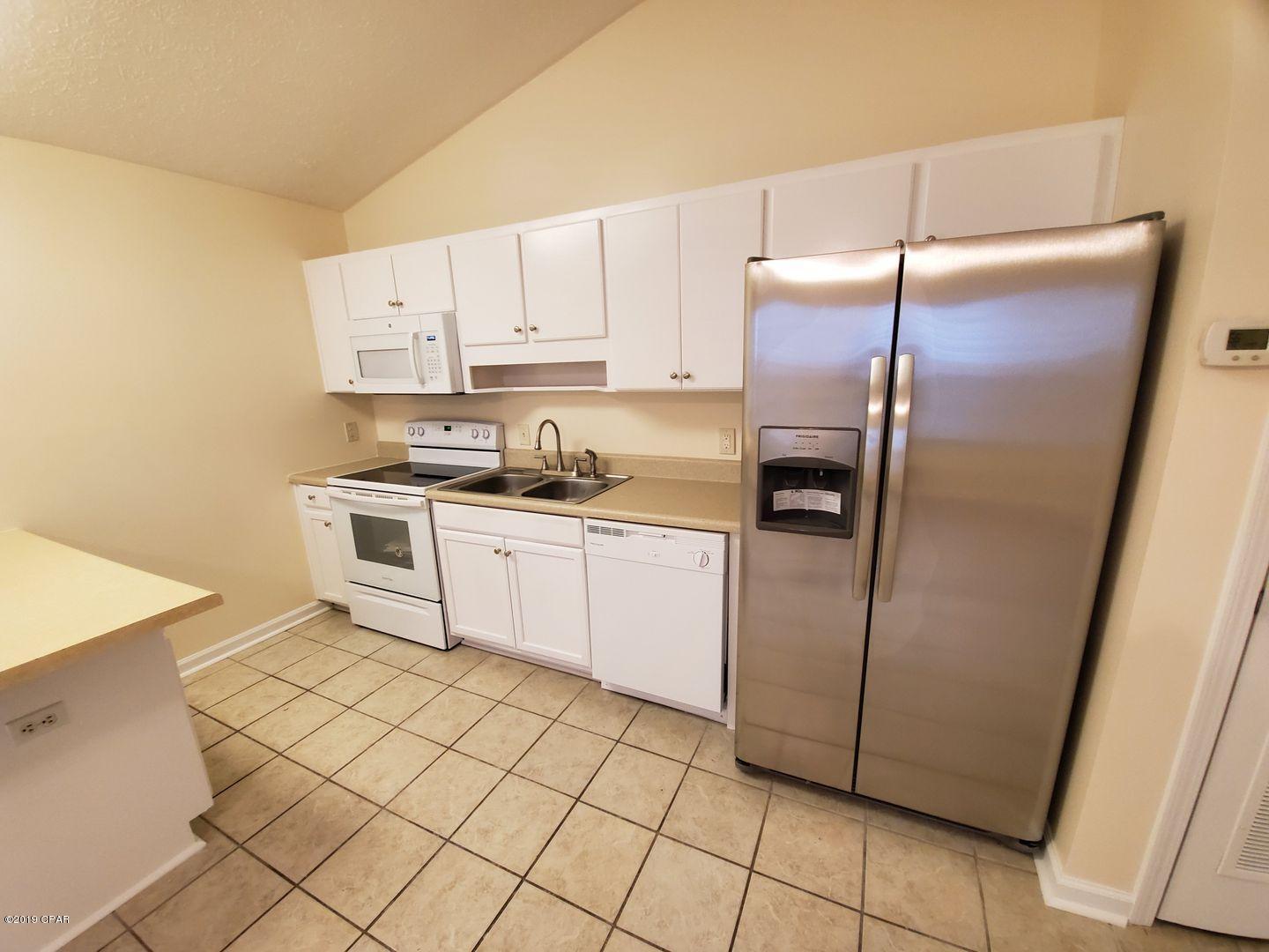 For rent! Unfurnished 2 BR| 2 BA duplex on North Lagoon Drive that is pet friendly! Newly updated with fresh paint, kitchen with all new appliances, including refrigerator, stove/oven, dishwasher and microwave. Includes washer & dryer! Bedrooms have new luxury vinyl plank flooring and updated bathrooms with new vanities and flooring. This is a super convenient location in the heart of Panama City Beach. Shared back yard; **Pets negotiable with non-refundable $250 pet fee.**
