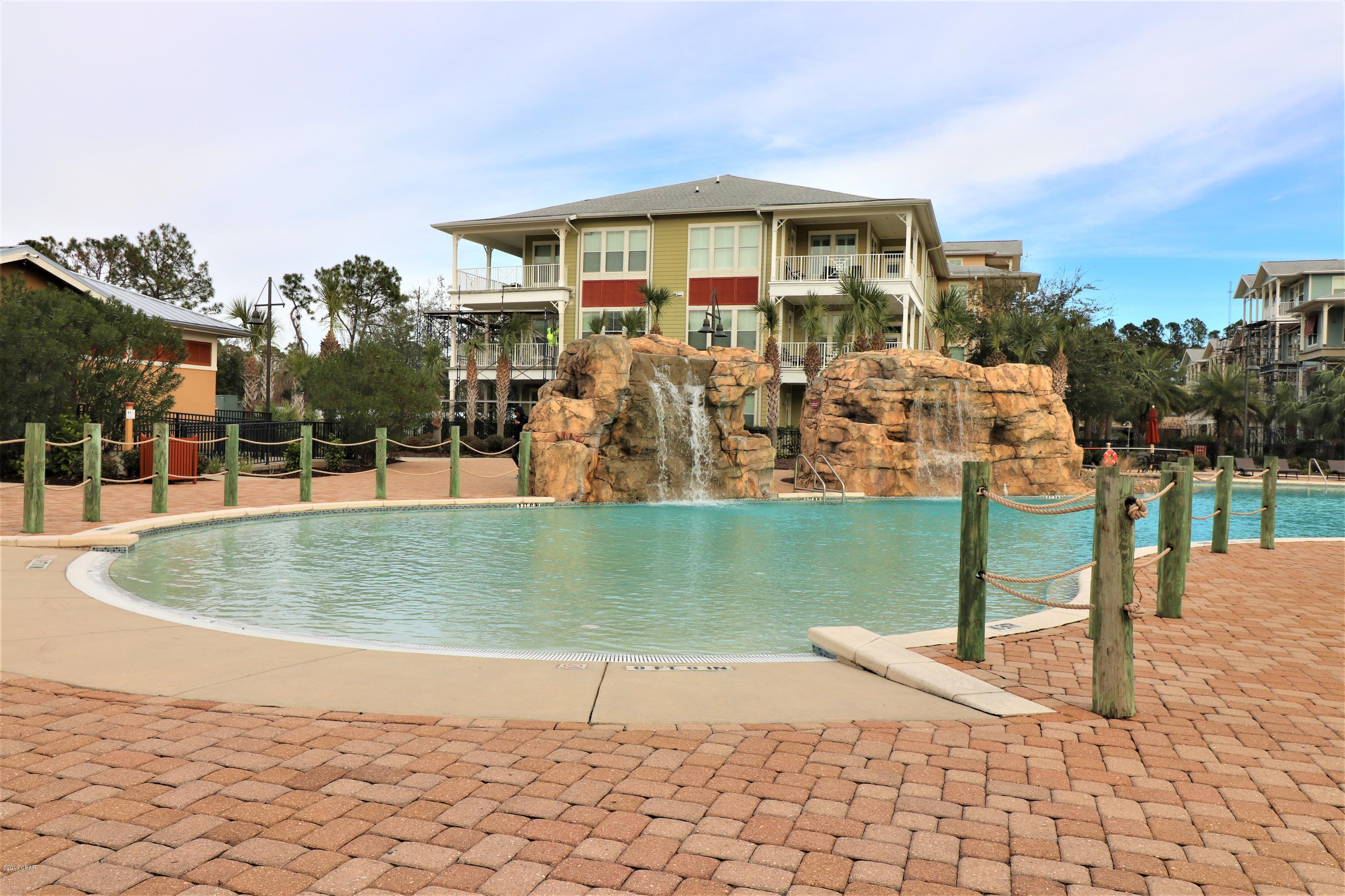 HOME CURRENTLY UNDER CONTRACT BUT SELLER WILL BE TAKING BACKUP OFFERS.  Panama City Beach Living!! Great Location on this gorgeous 2 bedroom 2.5 bath condo just mere steps away from a beautiful 1 acre zero entry pool at Island Reserve on Panama City Beach. Island Reserve features along with the tropical oasis zero entry pool and hot tub an indoor gym with a basketball court, fitness center, a club house with pool table and poker table as well as a theater room! This ground floor unit is very close to the covered parking garage so no stairs to climb or elevators to wait on!! Unit features 2 masters on opposite sides of the unit with full baths and large walk-in closets, garden tubs and separate showers! Great open Living, Dining and Kitchen area with lots of natural lighting and access to the open patio from living and bedrooms! Thank you for considering this home.  All measurements and information should be verified if important.