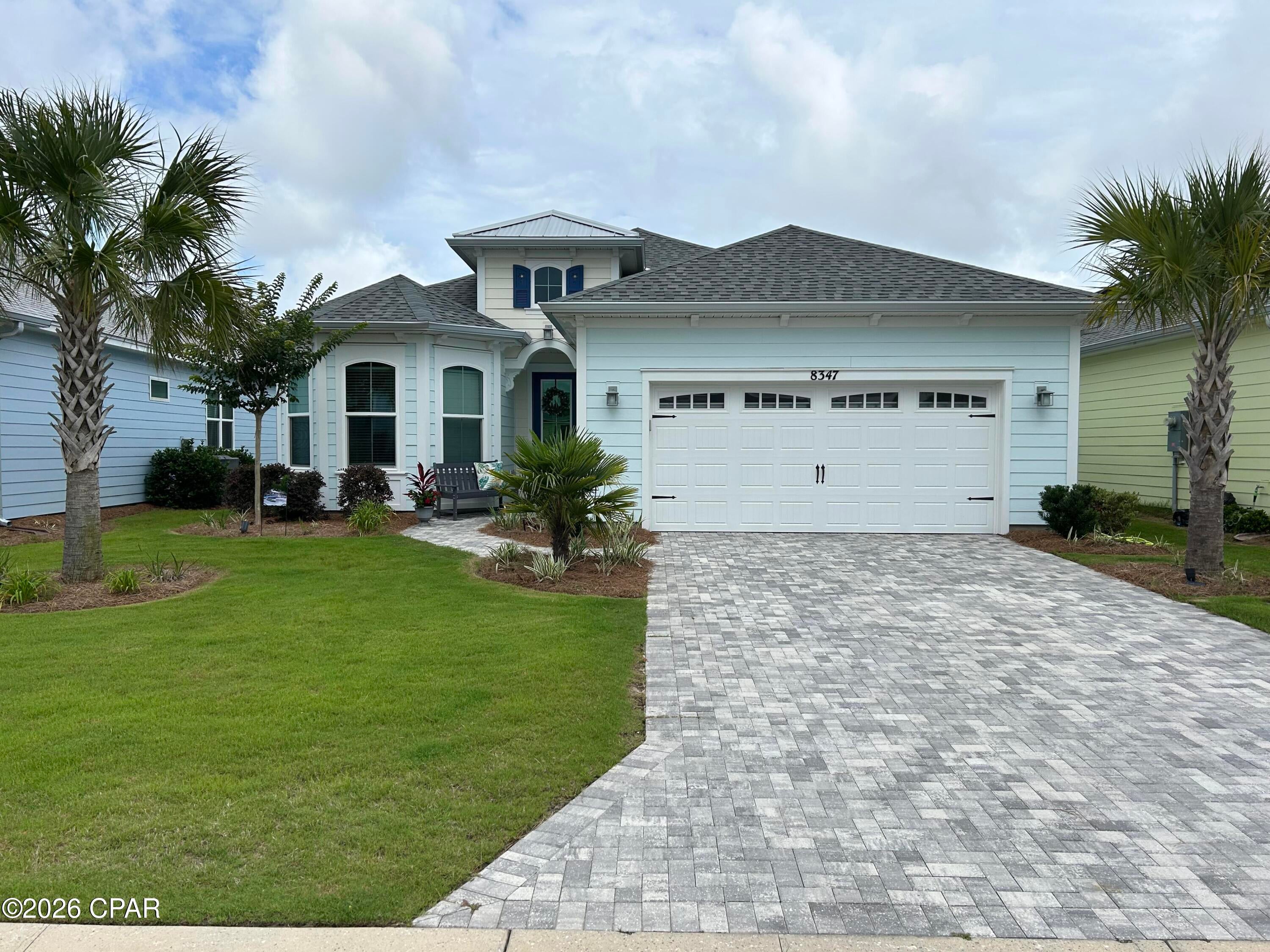 Peaceful pon d and preserve views where deer are often seen. Breeze Bay Home with 2 bedrooms, a den, 2 and a half baths, and a great room facing the soothing lanai with pool and spa. Entry opens to upgrades galore. Tongue and groove entrance hall ceiling with three hanging chandeliers. Shiplap cutout in the dining area. Enjoy cooler nights by the shiplap-surround fireplace in the great room with tongue and groove ceiling and beams. Kitchen island front is also shiplapped for finished decor. Beautiful evening sunsets to end your day. Home is located in Phase 3C, close to amenities in Margaritaville.