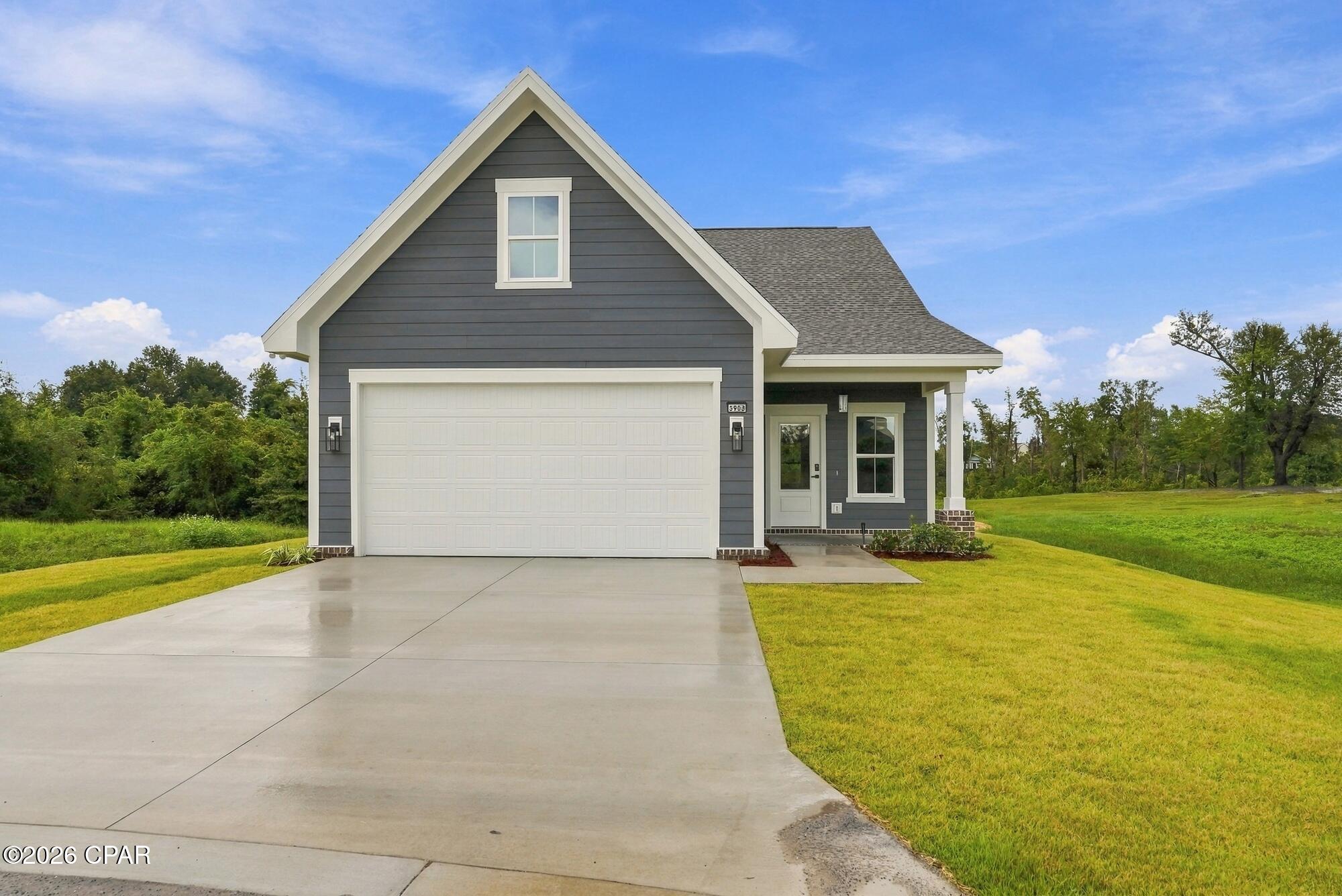 Welcome to this charming 3-bedroom 2.5 bath craftsman style home located in the Riverside community of Panama City! With a thoughtfully designed two story floor plan, this home offers plenty of space for both everyday living and entertaining.

The first floor features a bright, open concept layout connecting the kitchen, dining area, and living room, with abundant natural light and wood look flooring throughout the main living spaces. The kitchen offers stainless steel appliances, ample cabinetry, and an island overlooking the living and dining areas. The primary suite is conveniently located downstairs and features a private bath and walk in closet. A half bath and laundry room complete the first floor.

Upstairs, you'll find two additional bedrooms, a full bathroom, and a second spacious living room, giving you the flexibility for a family room, playroom, media space, or home office.

Enjoy the inviting covered front porch, attached garage, and all that the Riverside community has to offer. Neighborhood amenities include a community pool, clubhouse, fitness center, playground, basketball court, waterfront community dock and fishing access on Mill Bayou, along with a walking path through the community.