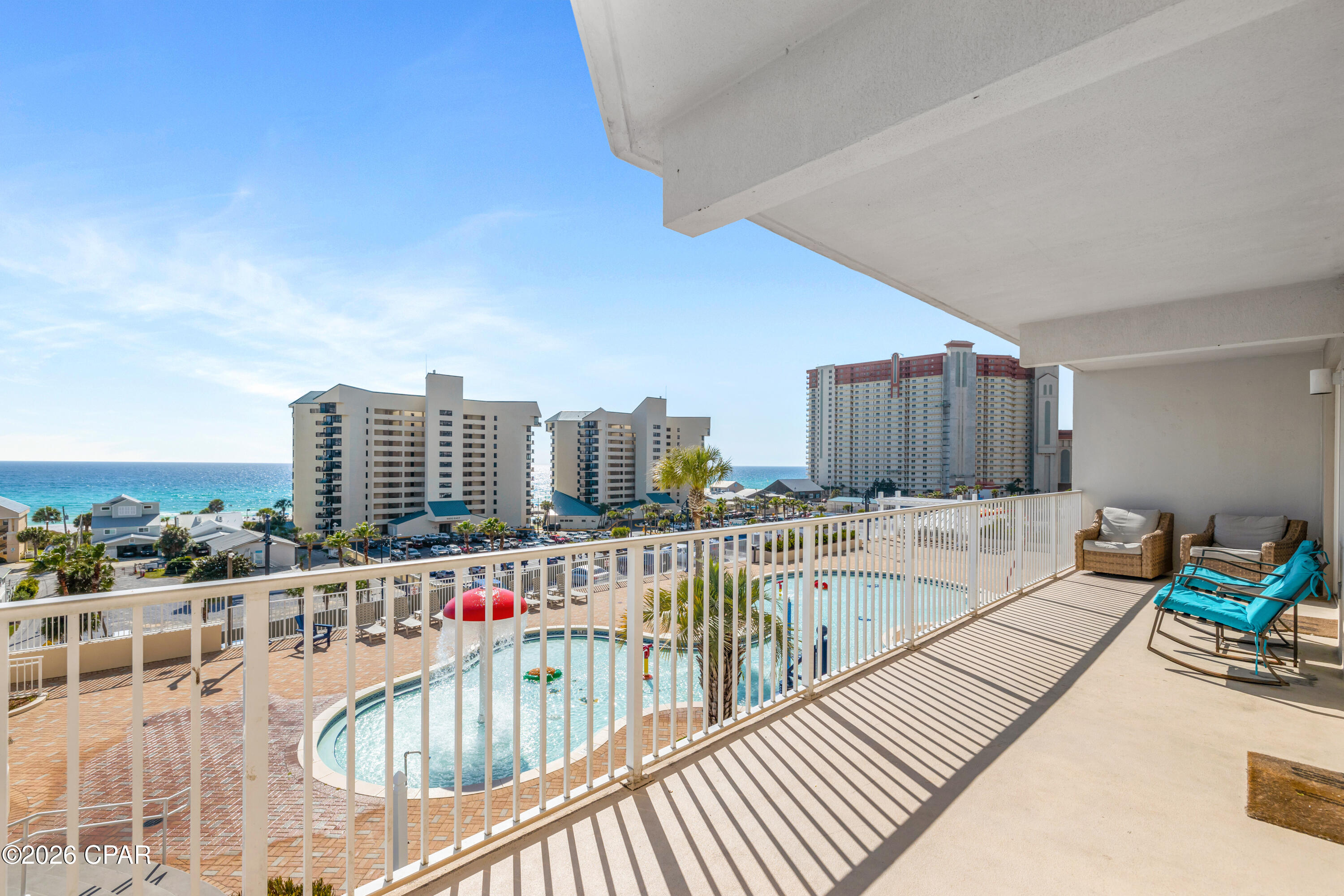 LOW-FLOOR GULF VIEWS | END-UNIT POSITION | WRAPAROUND BALCONY
Laketown Wharf Unit 501 | Panama City Beach, FL - Three-bedroom plus bunk room, end unit with a rare position within the building.
Located on the fifth floor, this unit represents the first level in Laketown Wharf where Gulf views begin while still maintaining a lower-floor elevation. Positioned on the southeast end of the building, with convenient access to the elevators and owners parking garage, but away from the heavy foot traffic areas.
The wraparound balcony overlooks the elevated ''kiddie pool'' deck on top of the south parking garage, featuring water features, lounge seating, and an active amenity area.
The balcony offers multiple access points, including the living area, primary suite, and a rare full door from one of the guest bedrooms--an uncommon feature within Laketown Wharf, primarily found in the first stack of the building. One section of the balcony remains shaded during ALL portions of the day and benefits from consistent airflow, creating a comfortable outdoor space for those who prefer to stay out of direct sun exposure.
The kitchen features updated recessed lighting, granite countertops, and stainless steel appliances. Coastal furnishings complement the interior, with tile and LVP flooring throughout for durability and ease of maintenance, along with a stackable washer and dryer.

Laketown Wharf is known for its unmatched amenities. Residents and guests enjoy five pools, including one heated year-round, two hot tubs, a fitness center overlooking the Gulf, a playground, pickleball courts, and mini golf. The 52,000 square-foot boardwalk circles the lake with a nightly fountain and light show. Direct, gated beach access sits next door to Pineapple Willy's. On the ground level, you'll find a lineup of restaurants, shops, and entertainment: Juan Taco, Wharf Seafood Buffet, The Candymaker Ice Cream Shop, PCB Pizza, In Cahoots for breakfast and brunch, The Press coffee shop, The Bun Lab, and more. The property also offers 810 Billiards & Bowling, a salon and nail bar, barbecue and pet areas, a poolside Splash Bar & Grill, two parking garages, and beach chair rentals. HOA dues are $3,527.73/quarter and include water, sewer, trash, cable/TV, pest control, WiFi, and full use of amenities. Nearby recently opened attractions include Dolly Parton's Pirates Voyage Dinner & Show, Topgolf, and McGuire's Irish Pub, with Tootsie's Orchid Lounge scheduled to open in 2026, reinforcing the area's continued growth. All information is deemed reliable but should be verified by the buyer if important.