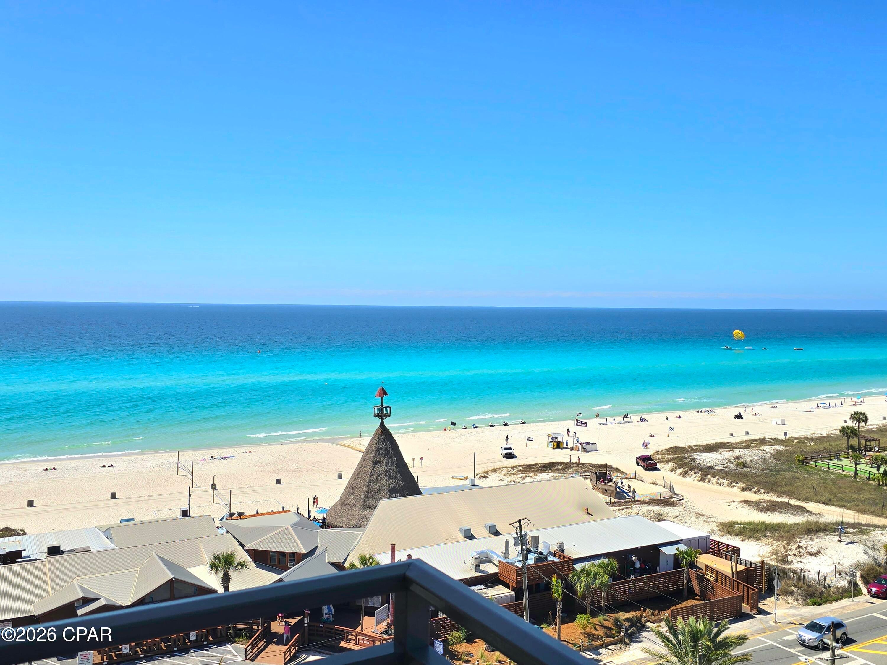 $53,744 in gross rental revenue from July 2025-July 2026 -- approximately 20% of the current asking price! This is a rare opportunity to own a turnkey, beautifully updated 8th-floor studio at Origin at Seahaven, one of the most desirable locations in Panama City Beach.

Unit 805 features Gulf and main-strip views from its private balcony, with the Gulf and beach directly across the street. Guests love this condo, with hundreds of 5-star Airbnb and VRBO reviews, making it an established and proven vacation rental.

The condo is sold fully furnished and turnkey, featuring a king bed + queen sleeper sofa, updated bathroom with new vanity, kitchenette with two refrigerators, new flat cooktop and microwave, color-changing electric fireplace, large TV, tile and luxury-plank flooring, and a private balcony where you can even watch the fireworks.

Enjoy resort amenities including a Gulf-view heated pool and hot tub, fitness center, arcade, movie theater, BBQ areas, covered parking and convenient beach access. Plus, you're minutes from Pier Park, Gulf World, restaurants, shopping and entertainment.

Minimal maintenance and easy ownership make this an especially attractive vacation-rental investment or second home. With proven rental income, an attractive purchase price, unbeatable location and the Gulf right across the street, opportunities like this don't come along often!