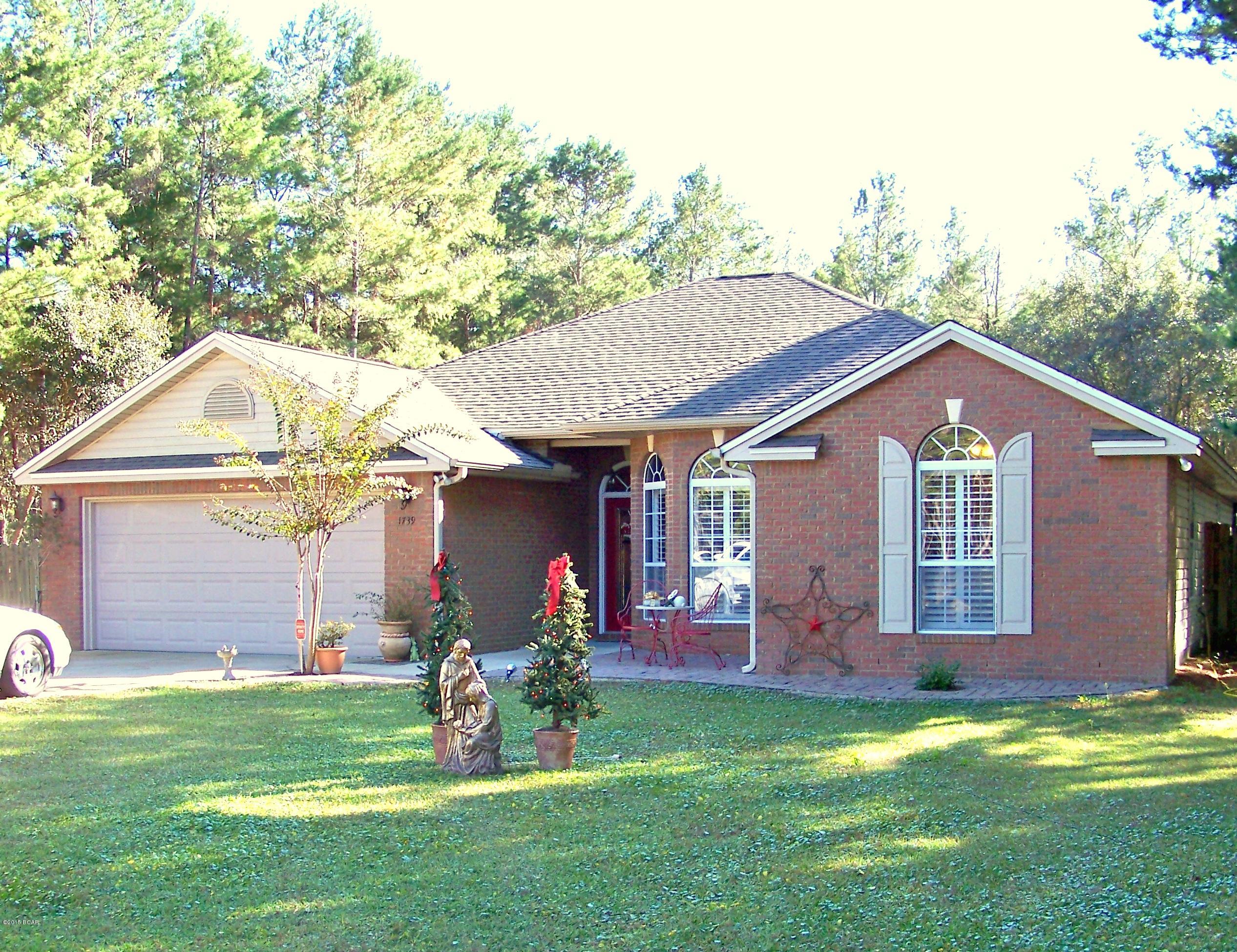 This gorgeous 4 br 2 bath home is nestled on just over a one acre lot and located just a few minutes north of Panama City off Hwy 77 near Dean Bozeman School.  The home features an incredible fully covered, heated, saltwater pool that is practically maintenance free, an open floor plan, raised ceilings, crown molding, brick and vinyl siding, wood and tile floors, plantation shutters, a breakfast bar, spacious dining area, a gigantic two car garage and a perfectly landscaped front and back yard with so many places to enjoy the great outdoors. Whether unwinding around the pool or just taking pleasure in the peacefulness and tranquility the  area seems to have, you have an assortment of outdoor spaces you will truly appreciate.   This home has been thoroughly maintained and is all set for the new homeowners to move into.  All measurements, room sizes and ages are approximate.  Please verify if important.