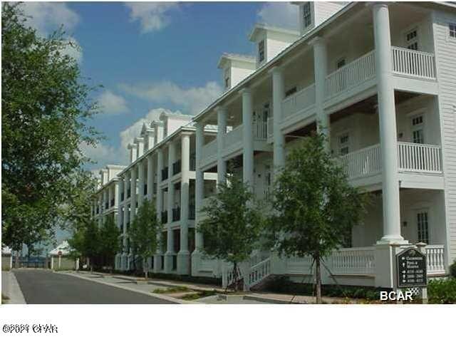 This gorgeous Waterhaven condo opens to a spacious hardwood floored great room with columns, beautiful crown molding and tray ceilings. Double French doors bathe the great room with natural light. A designated dining area and lengthy kitchen island accommodate plenty of seating. The master suite also opens to the covered porch. There are two guest rooms with roomy closets and a shared full bath, as well as a half bath off the hallway for guests. The laundry room adjoins the kitchen and has extra cabinets there for storage or pantry. There is an elevator for owner use, just steps from the back door. There is no need to climb the stairs! A new HVAC system was installed (inside and exterior) in 2020 and the entire home has been very well maintained.  The kitchen is made for your ''inner chef'' with a Viking Professional gas range and range hood. The microwave is low and convenient. The refrigerator is a Sub Zero with ice maker. Don't miss the separate ice maker and wine cooler, making this an entertainer's dream. There are ample solid wood cabinets and granite counters to serve and prepare your culinary creations. Glass front cabinets in the kitchen show off your pretty dishes and glassware. Other features carried throughout the condo include five panel doors, beautiful crown molding, and luxurious commercial grade carpeting in the bedrooms. Another perk is a spacious storage closet in the building on the fourth floor. 
Waterhaven itself is a wonderful quiet community on the Bay with a magnificent Bay front pool (with his and her restrooms), a boat ramp, boat slips available to purchase for residents only, a day dock if you don't own a slip on the longest dock in St. Andrew's Bay. The Community Center has a community room & kitchen for your larger gatherings, a movie theater, a fitness center, a summer kitchen, and back deck.
There are no rentals allowed in this community (short or long term) and the gate helps provide security. For a peace filled low maintenance home with some of the best amenities on St. Andrew's Bay; please look at this wonderful home. Call your Realtor today!
