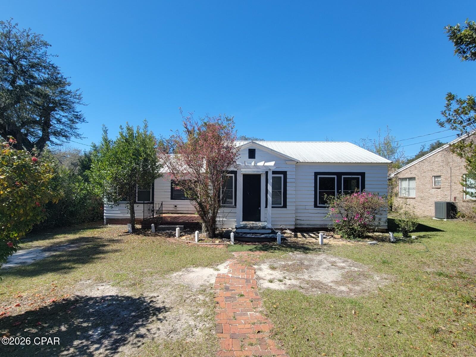 Charming 3 bedroom, 2 bath home located in central Panama City- (located in the Cove). Electric, Water, sewer, garbage, and lawn care included with the rent. The home has been freshly painted inside, and the hardwood flooring has been recently refinished. The home equipped with range, dishwasher, and refrigerator. Also has washer & dryer connections. The home is located 3 blocks from the bay where you can enjoy beautiful sunsets. Or journey  to downtown Harrison Ave where you can enjoy shopping, restaurants, and local events.  Call to schedule a tour.