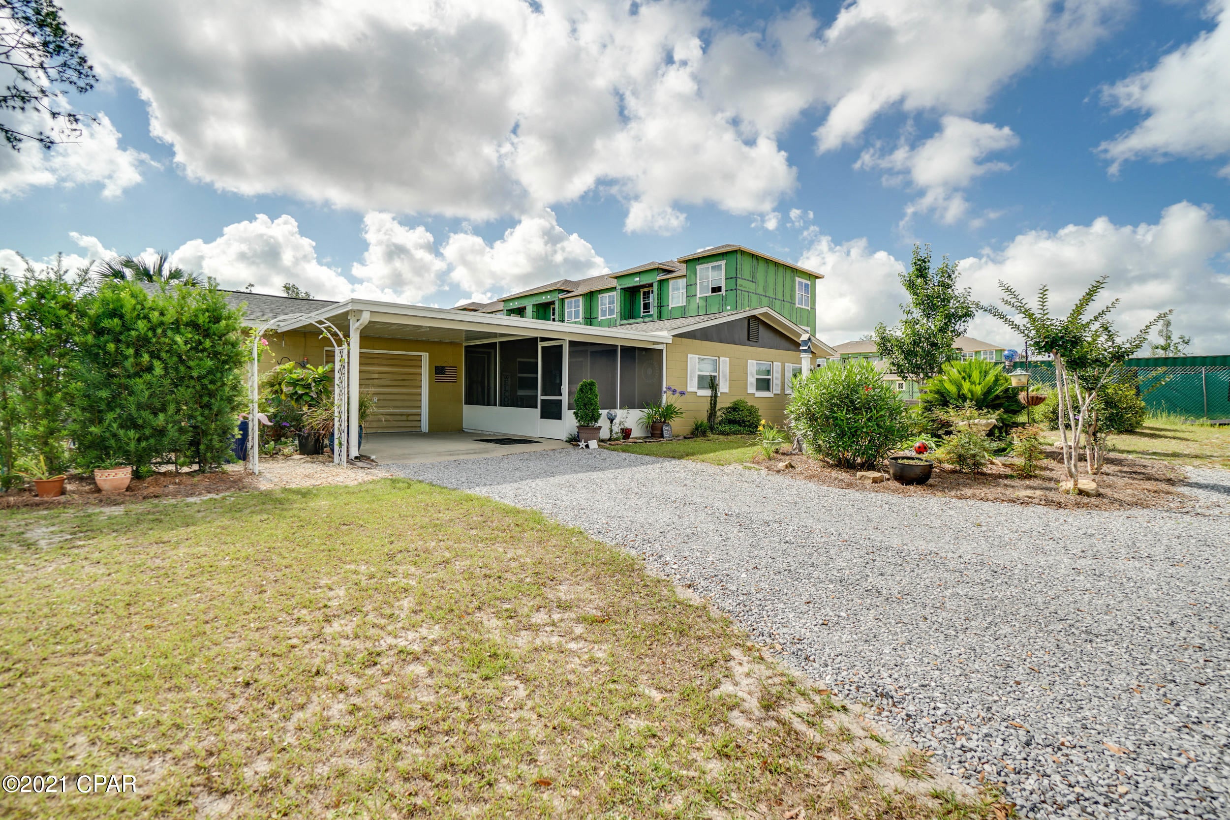 CURRENTLY UNDER CONTRACT, SELLER ACCEPTING BACKUP OFFER A well maintained cottage style home on almost a full acre of land in Panama City. Conveniently located next to the Lynn Haven Sports Complex and less than a 10 minute drive to most shopping centers and restaurants. Since 2019, this home has seen a brand new roof, new vinyl flooring, drywall and paint, as well as a new carport and enclosed patio. With plenty of storage in the double car sized garage as well as an office/workroom, you can be really creative with the space in  this home.