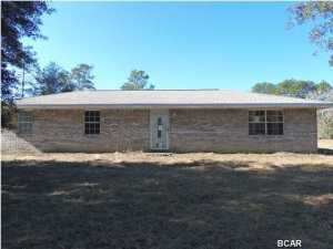 Country Living! Don't pass this quaint little house by! This 3 bedroom, 1 bath home has an oversized living area, large laundry room, open kitchen with lots of cabinets and is located on over 2 acres in a great horse community just 30 minutes from Panama City! Close to gas station and small grocery store - this idyllic neighborhood backs up to the Water Management District for miles and miles of riding trails. (all sizes approximate and taken from public records, buyer to verify any details buyer deems important)