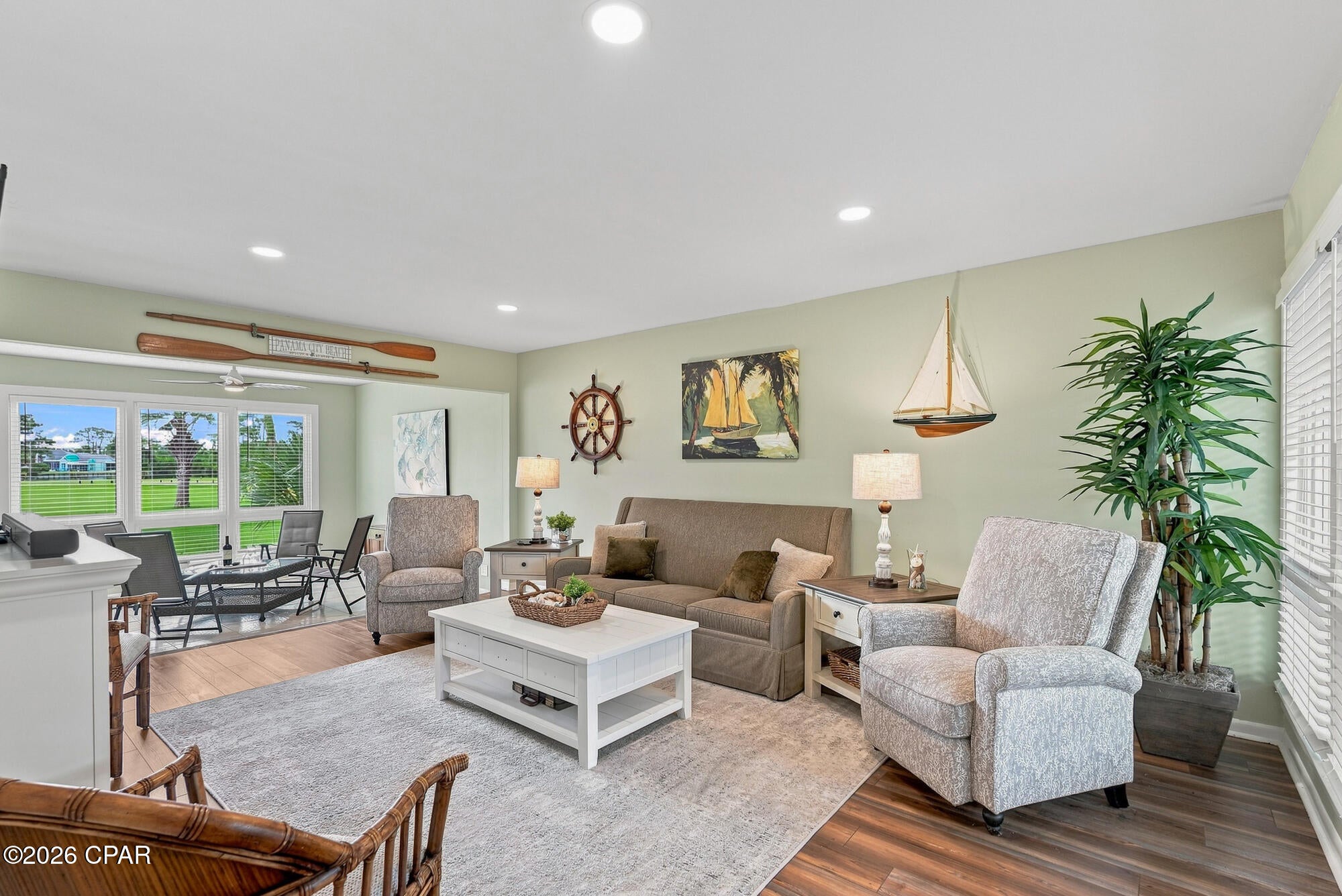 Looking for the perfect blend of golf, boating, and coastal living? This beautifully updated 2-bedroom, 2.5-bath Golf Villa checks all the boxes. Nestled in a gated, golf cart-friendly community with on-site security, you're just steps from the Jack Nicklaus Championship Golf Course, the 180-slip marina, tennis courts, spa, and on-site dining--plus only a short drive to Panama City Beach favorites like Schooners and Tootsie's.

Inside, you'll find full of natural light, bright and open layout with peaceful pond and golf course views, a beautifully updated kitchen with new cabinetry, countertops, stainless steel appliances, and LED lighting, plus a cozy shiplap accent wall that adds the perfect coastal touch. Fresh paint, plantation shutters, remodeled downstairs bath, updated lighting and fixtures throughout, a full-size washer and dryer, and numerous additional upgrades make this home truly move-in ready.

Upstairs, both spacious bedrooms feature private bathrooms and balconies, while the primary suite offers a walk-in closet and relaxing water views. The Florida room provides the perfect spot to enjoy your morning coffee or unwind after a day on the course or the water.

Sold fully furnished (excluding select personal items) and comfortably sleeping up to 8 guests, this villa is equally suited as a primary residence, second home, or vacation retreat.

The COA fee provides exceptional value by covering building insurance (including fire, wind, and flood), along with reserves for exterior windows and doors, exterior painting, roof replacement, and ongoing exterior maintenance and repairs--allowing you to enjoy low-maintenance coastal living.