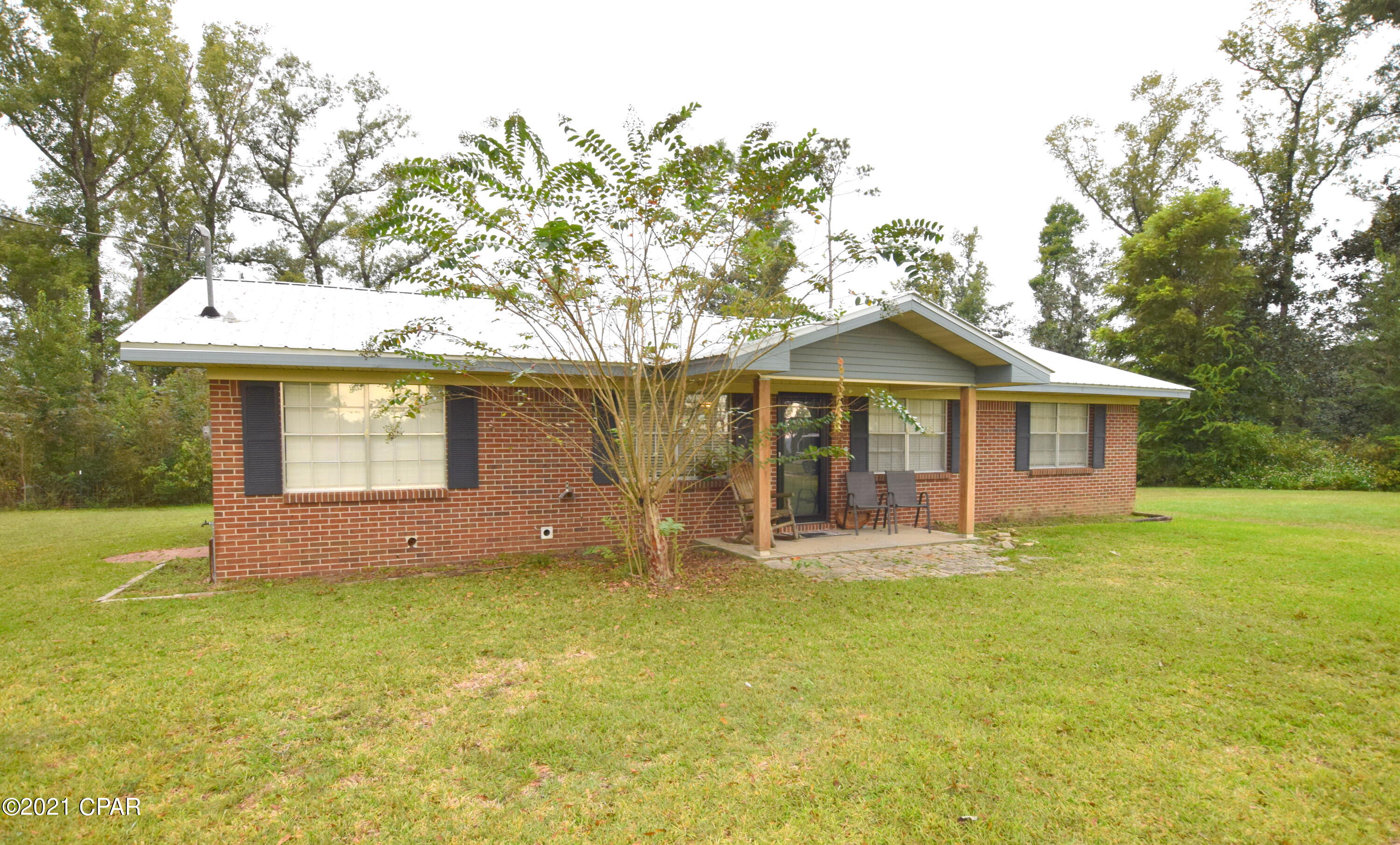 Located in a relaxed, country setting just minutes from town, sits this well-maintained brick beauty! Step inside and you will find 3 bedrooms, 1 bath, a spacious living room open to the eat-in kitchen with island and a 17x11 Bonus room featuring a wood burning stove. Enjoy your time outside watching the sunrise from your covered front porch, grilling on the newly constructed back porch or tinkering in the 24x36 barn complete with 2 roll up doors. Home is situated on 1.1+/- acres atop of Orange Hill close to Hwy 77 and 231.