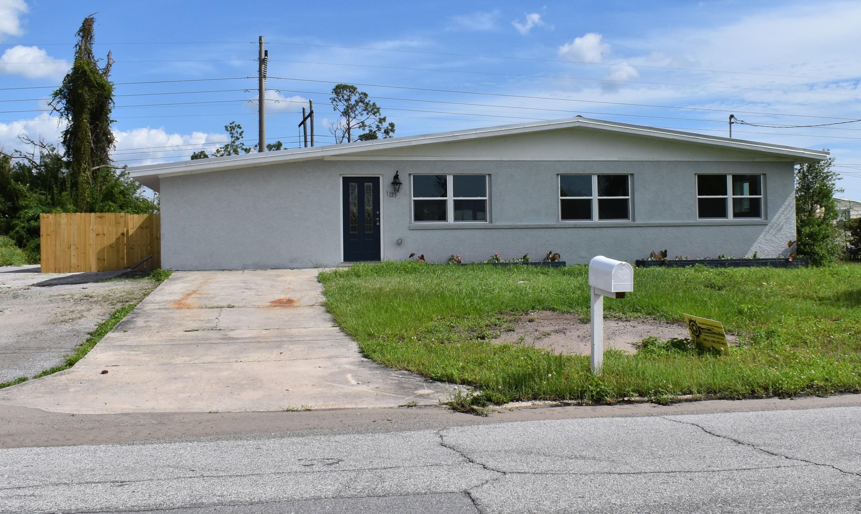 Completely remodeled in the middle of town! This 4 bedroom, 2 bath home sits on a good sized lot in a centrally located neighborhood.  All tile and LVP throughout with open kitchen and lots of living space. Huge Master Suite with a fireplace! Fully fenced backyard with shed for storage space.