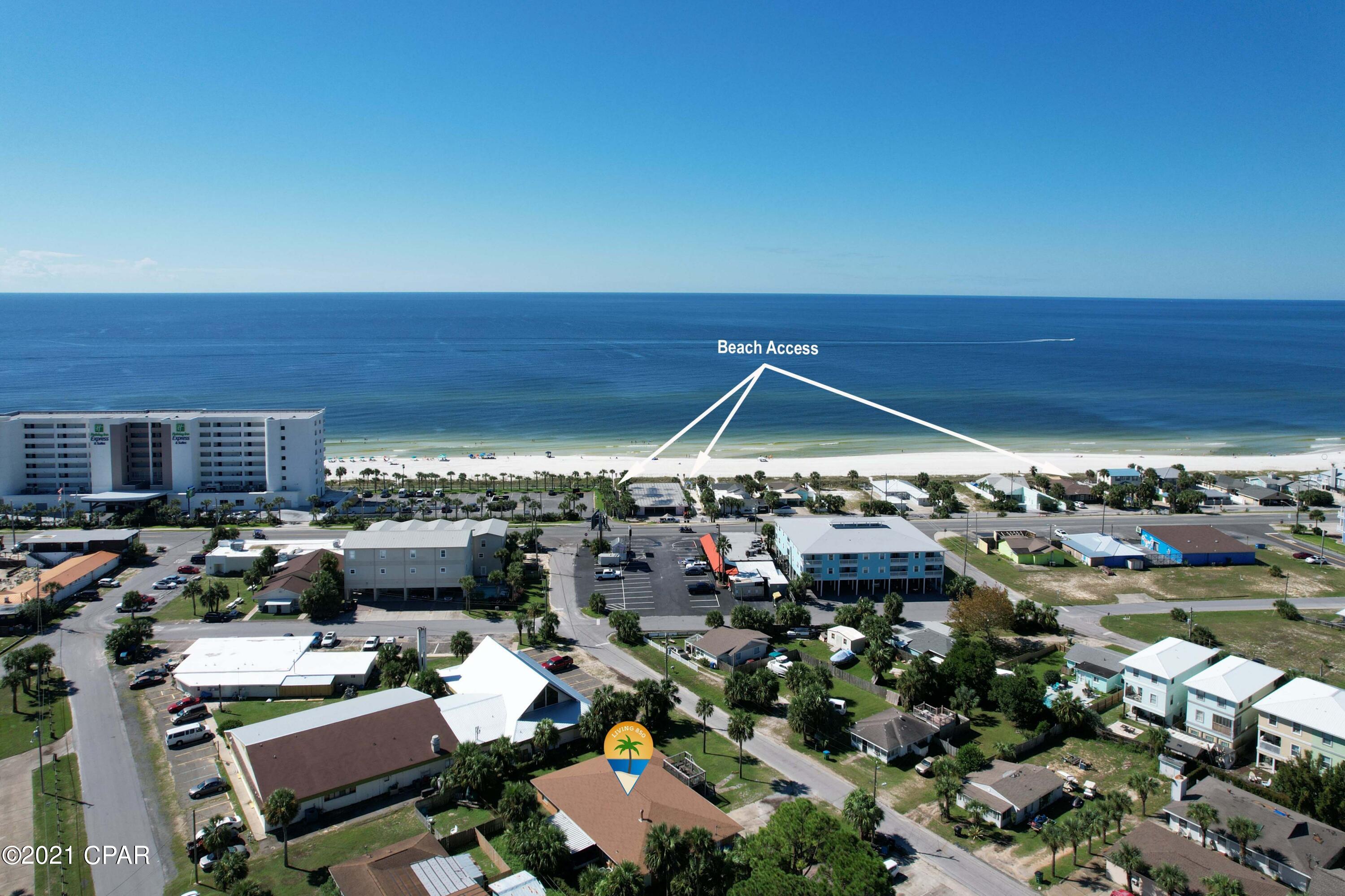 Talk about close to the beach! 621 Gardenia Street is a very short walk to multiple beach access points. This home boast over 3000 square feet with 5 bedrooms, 3 full bathrooms and 1 half bath. Property is currently an excellent vacation rental and even has the option to be split into two separate units with just the shut of one door! This home sits on a large 120' wide by 103' deep lot that could be split and allows for multiple development opportunities. Two and three story builds would allow for expansive views of gulf and face sunset. The location is in the heart of PCB with restaurants/bars within walking distance, Pier Park less than 3 miles away and the beach only steps away!