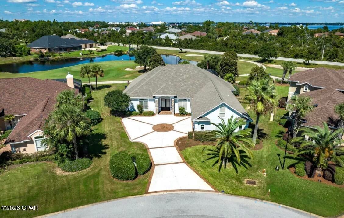 Experience elevated golf course living at 109 Dragon Circle, ideally positioned along the 8th green and 9th tee box of the prestigious Nicklaus Golf Course in Dragon's Ridge, the newer gated section of Bay Point in Panama City Beach. This beautifully updated residence blends refined finishes, generous living spaces, and resort-style outdoor living in one exceptional setting.
Inside, an impressive, oversized kitchen island anchors the open entertaining space, complemented by updated bathrooms, flooring, and fresh interior and exterior paint. Spacious rooms and thoughtfully designed gathering areas create an effortless flow for both everyday living and entertaining.
Outdoors, a private pool and hot tub overlooking the golf course create a true backyard retreat. The recently resurfaced pool, expansive outdoor space, three-car garage, oversized driveway, and park directly across the street further enhance the home's appeal. Bay Point offers a lifestyle unlike any other, with the Nicklaus Golf Course, Point South Marina, Gulf access, community boat launch, dining, playgrounds, and more just moments away. Whether enjoying an afternoon on the course, boating the Gulf, or relaxing poolside, 109 Dragon Circle delivers luxury coastal living in one of Panama City Beach's most desirable gated communities.
