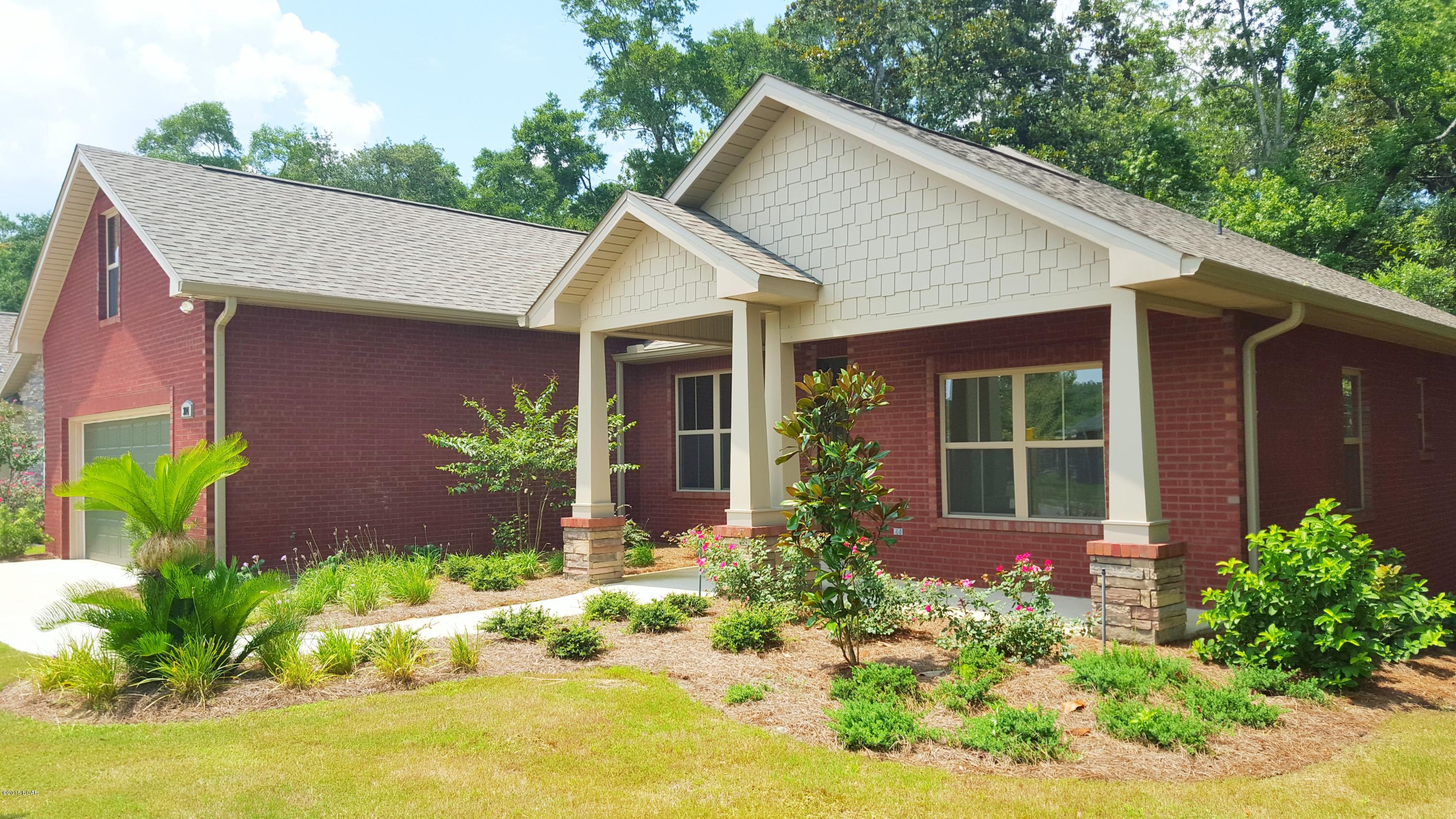 PRICE REDUCTION ON NEW CONSTRUCTION!!! CONSTRUCTION COMPLETE!! LYNN HAVEN 4 BEDROOM 3 FULL BATHS- Brand new brick home with beautiful stone accents featuring a high and dry lot overlooking a wooded landscape. INTERIOR: This open floor plan offers large volume living room with hardwood flooring and fireplace, designer grade kitchen complete with island bar and stainless steel appliances, formal Dining Room, Breakfast Room, Master Bedroom and En-Suite with separate shower, tub, and double vanity. Private Home Office, two additional Bedrooms (each 12x12) and a second level Bonus Room that's great for entertaining family and friends. EXTERIOR: features brick and stone siding, sprinkler system, two car garage, and decorative concrete work. All information is estimated including  measurements, age, square footage, and school zones. Click pic for additional photos, virtual tour, and homes website.