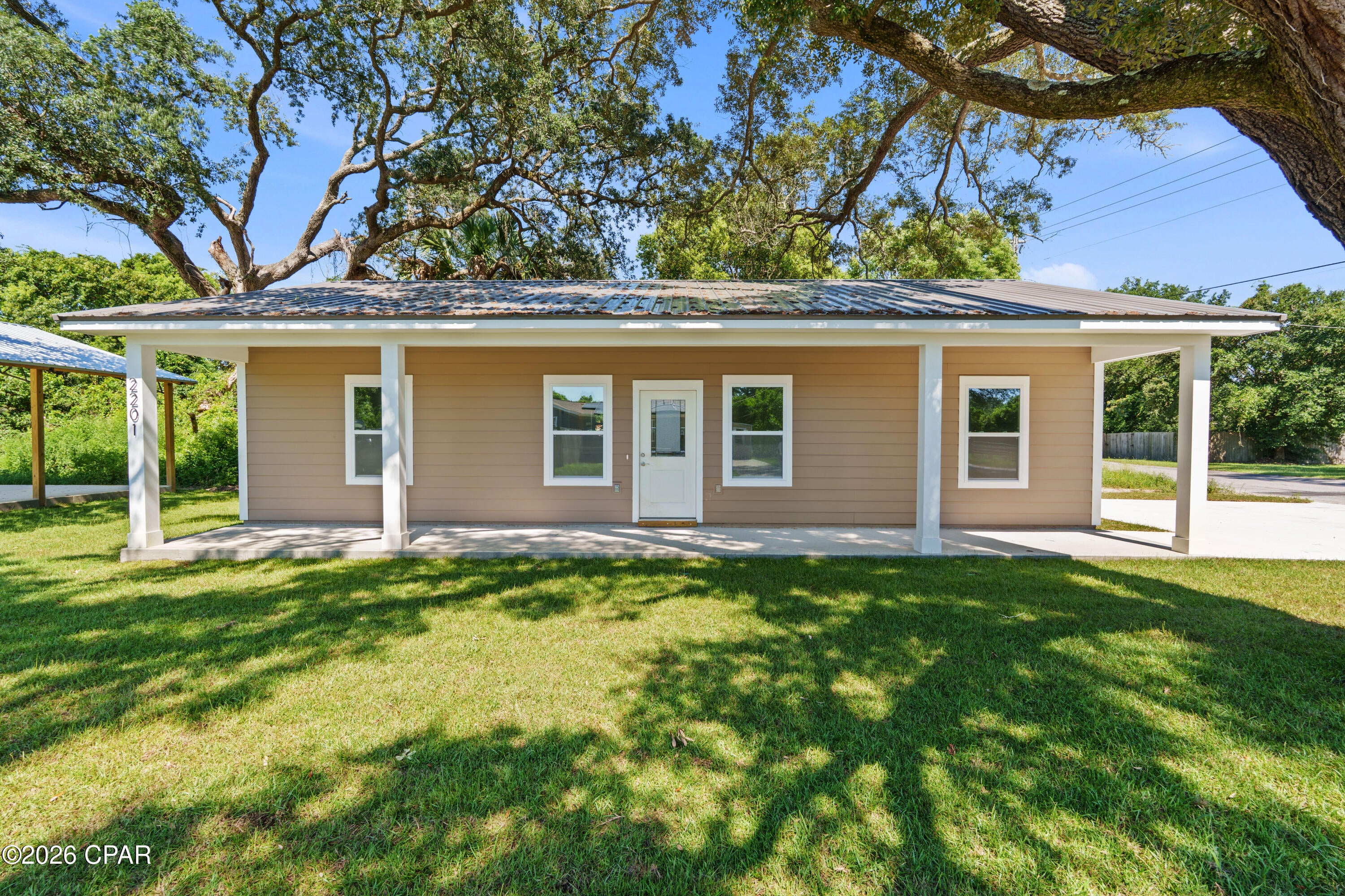 PRICED TO SELL! PLUS $10,000 TOWARD BUYER CLOSING COSTS!

Freshly repriced and offering exceptional value, this brand-new construction home is move-in ready and designed for comfortable, low-maintenance living. Featuring 3 bedrooms, 2 bathrooms, and nearly 1,200 square feet, this home is the perfect opportunity for first-time homebuyers, downsizers, or anyone looking for an affordable home without sacrificing quality, style, or modern finishes.

Step inside to a bright, open-concept floor plan featuring 9-foot ceilings, luxury vinyl plank flooring throughout, elegant quartz countertops, and a complete appliance package. Even better, the sale includes a brand-new refrigerator, range, dishwasher, microwave, washer, dryer, and a deep freezer--making this truly move-in ready and helping first-time buyers save thousands on upfront expenses.

Built with quality and efficiency in mind, the home features Hardie Board siding, hurricane-rated windows and doors, and full spray foam insulation, providing durability, lower energy costs, and year-round comfort.

Outside, relax on the charming full-length front porch or take advantage of the spacious pole barn, offering endless possibilities for storage, a workshop, recreational equipment, or hobby space.

Conveniently located just minutes from Downtown Panama City, you'll enjoy easy access to shopping, dining, schools, parks, and entertainment--all with the added benefit of NO HOA.

To help buyers envision the home's full potential, select listing photos have been virtually enhanced using AI to illustrate possible interior staging. These images are for visualization purposes only and do not represent the property's current condition or included improvements.

With a new price, $7,500 toward buyer closing costs, an extensive appliance package, NO HOA, and quality new construction that's ready for immediate occupancy, this home offers an incredible value. If you've been waiting for the right opportunity to purchase your first home, this could be the one. Schedule your private showing today before it's gone!