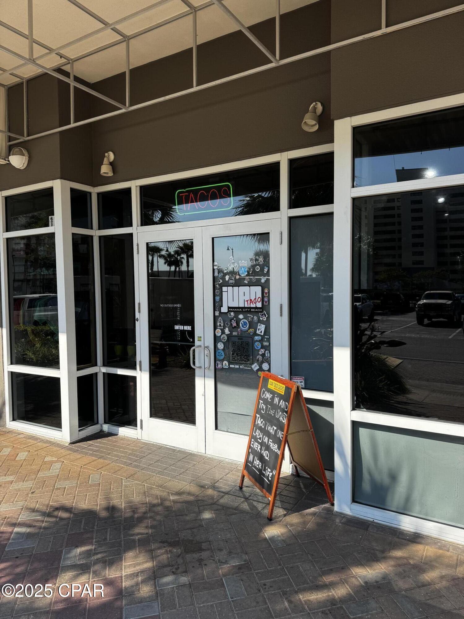 OWNER FINANCING AVAILABLE. A rare opportunity to purchase a retail unit at Laketown Wharf currently established as a restaurant. Plenty of parking. This unit can also be retro fitted to use as any kind of retail business. There are two entrances one facing Thomas Drive and one facing the Lake. Laketown Wharf has over 700 residential units which provide on-site clients as well as thousands of short term vacation renters. The unit faces Thomas Drive and is located at one of the busiest intersections in Panama City Beach insuring unparalleled visibility.