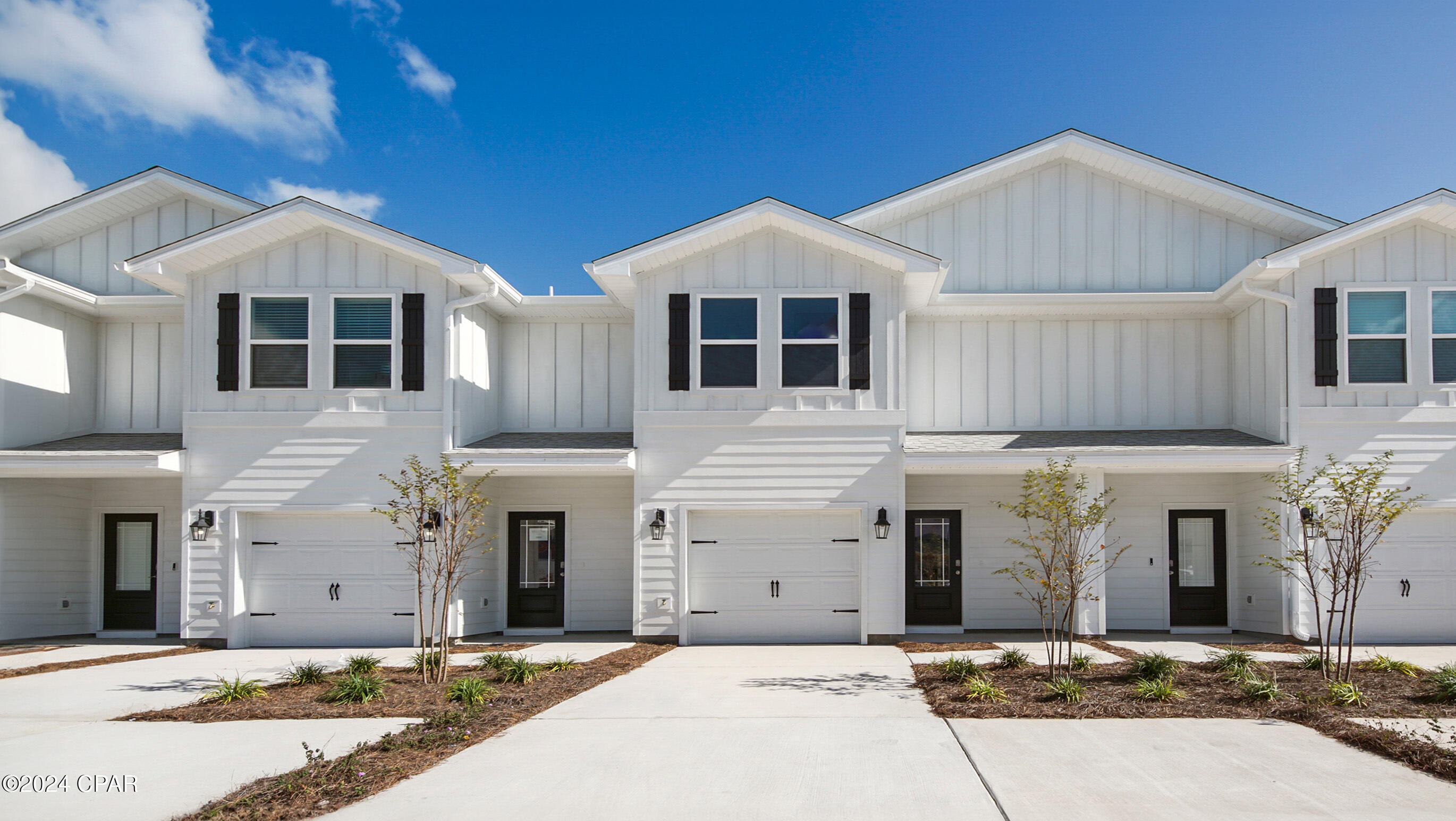 This townhome offers a welcoming space that has 3 bedrooms, 2.5 bathrooms, and a convenient single car garage. The bright entry leads to an open kitchen, living, and dining area that is designed for comfort and everyday living. The kitchen serves as the culinary center with a spacious center island, beautiful white cabinetry, granite countertops, and a premium stainless steel appliance package including a smooth top stove, microwave and dishwasher. Beautiful windows surround the living area allowing for natural light. 

The first floor is the heart of the home, while the privacy of the second level has all bedrooms, ensuring a quiet retreat. The main suite features a generous closet, an oversized shower, dual sink vanity, and a linen storage area in the private bath. Two additional bedrooms share a hall bath with shower tub combo that create a comfortable space for family or guests.   

 The interior features include EVP flooring throughout the main level and second level bathrooms and plush carpet on the stairs, upstairs hallway and bedrooms, Smart Home Technology Package comes standard, featuring a Qolsys IQ touch panel for thermostat and lighting control, ensuring security and convenience. Exterior features of Bayside at Ward Creek townhomes are equally impressive, with Hardie® siding and thoughtful lighting at the garage, front entry, and back patio. A landscaped front entry adds curb appeal and welcomes you to your very own slice of Florida paradise awaits. The back patio looks over the tree line with no neighbors behind you creating a great space to sit and enjoy nature. Call today for a tour of this floor plan.
