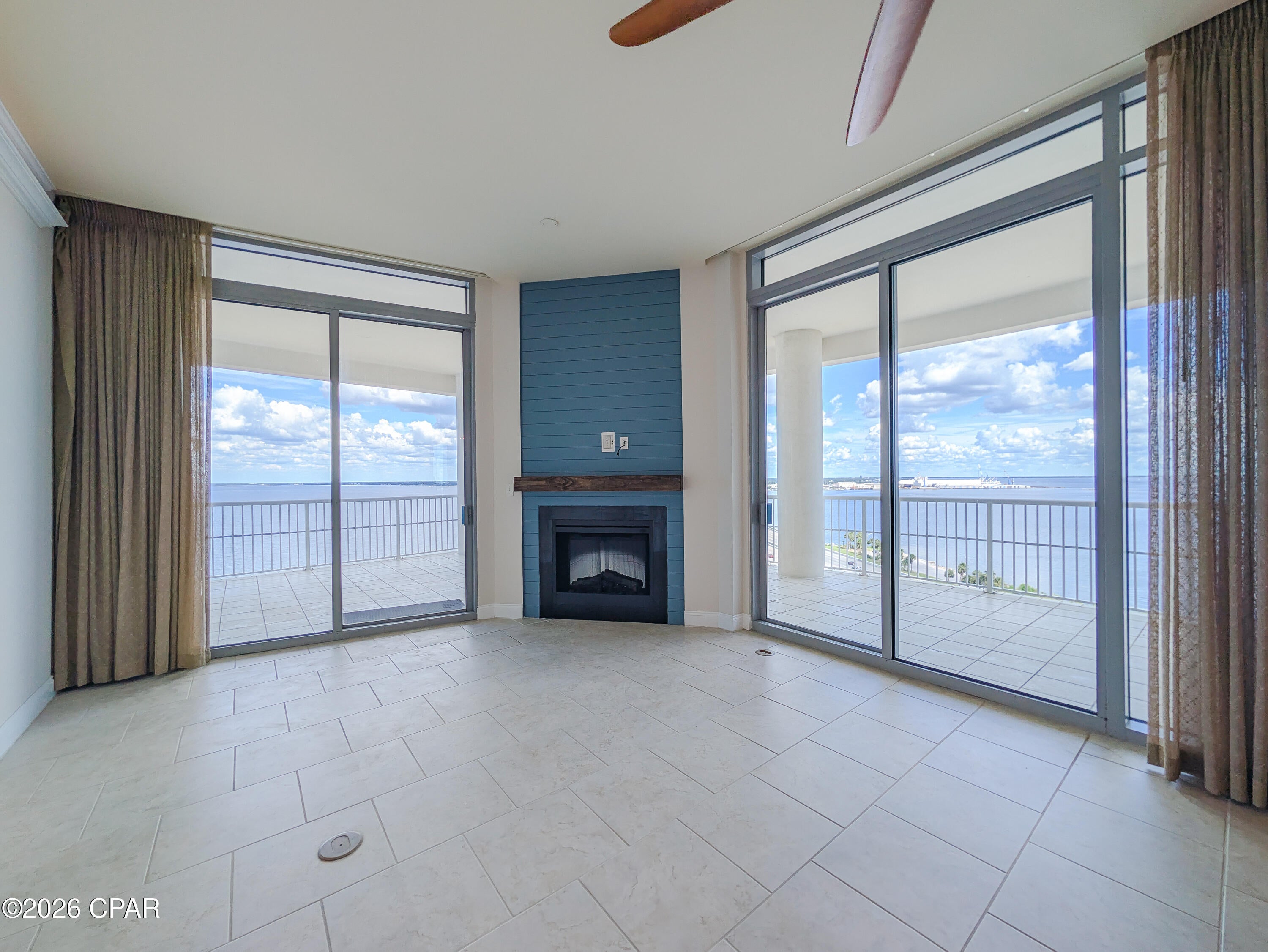 COMING SOON - NO SHOWINGS - The door opens and the room does something most rooms don't -- it goes up. Eleven-foot ceilings lift the whole space, and the light that comes with them is bay light: wide, moving, a little different every hour. This is the top of Marina Landing, and from up here St. Andrews Bay isn't a view you go looking for. It's simply there, in every window, in every room.

Mornings start slow. Coffee on the balcony while the water is still glass and the first boats ease out of the marina below. By ten the bay has picked up its chop and its color, and the light comes off it and onto your ceilings in a way you'll catch yourself watching from the kitchen. Afternoons belong to the water -- paddle board, boat, or the long walk down to the pier. 

Three bedrooms and three full baths mean the people you love can actually stay. Guests wake up to the same bay you do. Grandkids claim the balcony. The primary suite faces the water, so the last thing you see at night and the first thing you see in the morning is the bay, quiet and lit.

The 1916-square-foot floor plan lives large without feeling cavernous -- the height does that. The kitchen opens to the living space so no one is cooking alone. 685 square feet of balcony wraps the living areas, wide enough for a real table, a grill, and chairs that don't get folded up and put away. The building's amenities --  gym, owner's party area, private pier, boat slips available to lease next door -- sit just downstairs.

Marina Landing is a residential waterfront community, not a rental building. No vacation rentals, six-month minimum lease. That's why the halls are quiet and the neighbors know your name.

Penthouses in this building don't come up often, and eleven-foot ceilings with bay views from every window is a combination you can't renovate your way into. This one is pristine and ready for you.

Come see what the light does at five o'clock.