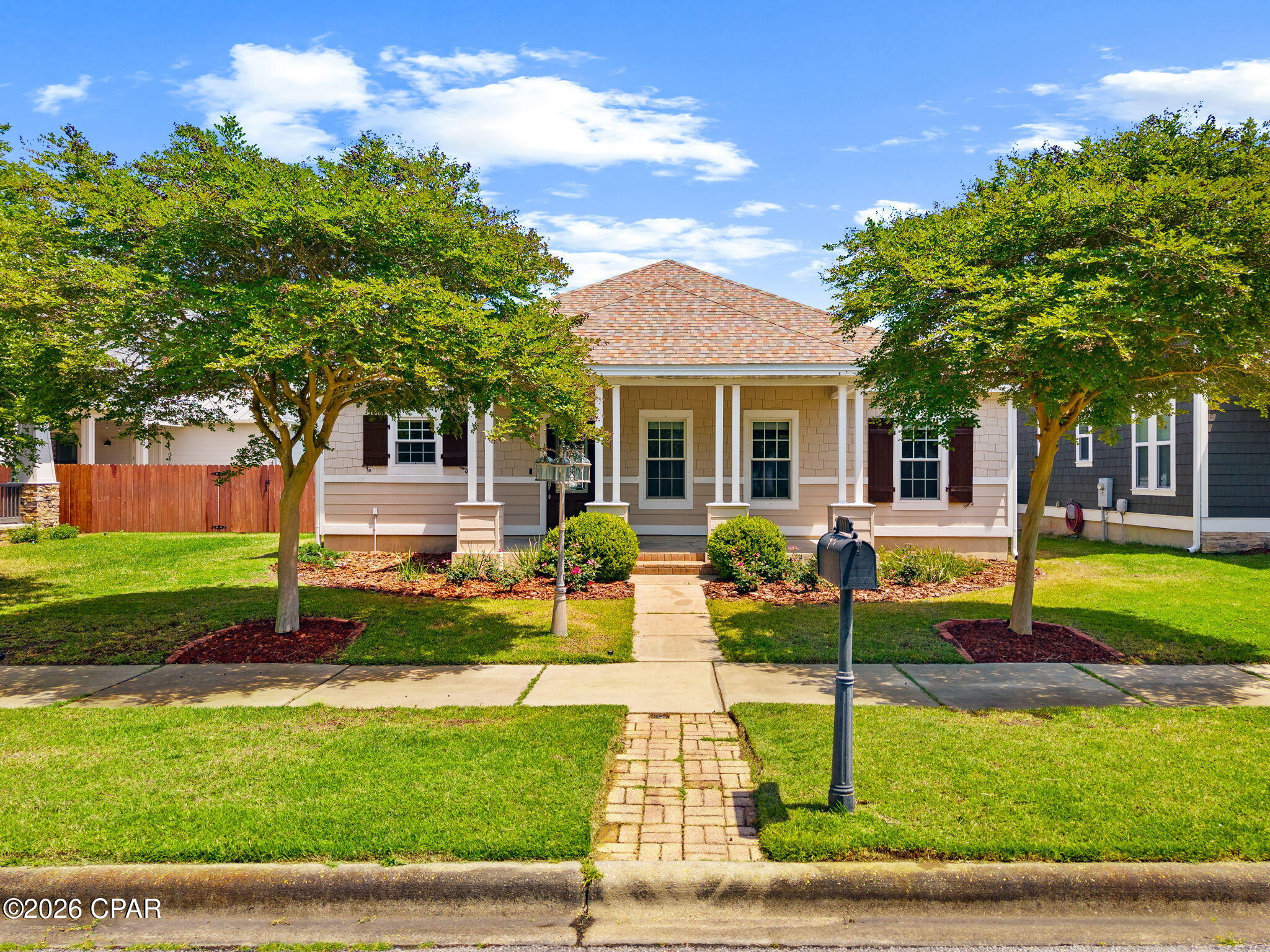 Welcome home to 303 Coral Gables Street in Panama City Beach. This 3 bedroom, 2 bathroom single-story Craftsman style home is located in the highly sought-after Tapestry Park community--a charming, family-friendly neighborhood known for tree-lined streets, front porch living, and resort-style amenities. This beautifully maintained home offers comfortable coastal living just minutes from the white-sand beaches of the Gulf of Mexico, making it ideal as a primary residence, second home, or beach-area retreat.

Tapestry Park residents enjoy exceptional neighborhood amenities including a resort-style community pool, clubhouse, basketball and tennis/pickleball courts, and Peacock Park playground, creating a vibrant and welcoming environment for families and neighbors.
Inside, you'll find a bright, open layout designed for easy living and entertaining, with inviting indoor and outdoor spaces perfect for enjoying family time and relaxing after a day at the beach. The primary suite is a sanctuary - with a custom walk-in closet and en-suite bath that features dual vanities with granite countertop, a step in shower, and separate jacuzzi tub. 

The two car garage has shelving to store your seasonal collections and leads into a rear foyer/flex space conveniently next to the large laundry room with washer and dryer included.

The welcoming front porch adds to the neighborhood's classic coastal charm and encourages connection with the friendly community.

Conveniently located in Panama City Beach near shopping, dining, entertainment, and top local attractions, this home offers the perfect balance of coastal lifestyle, community amenities, and everyday convenience - all just 1/2 mile to the sugar sand and emerald water. Seller offering $10,000 credit toward rate buy down or closing costs.