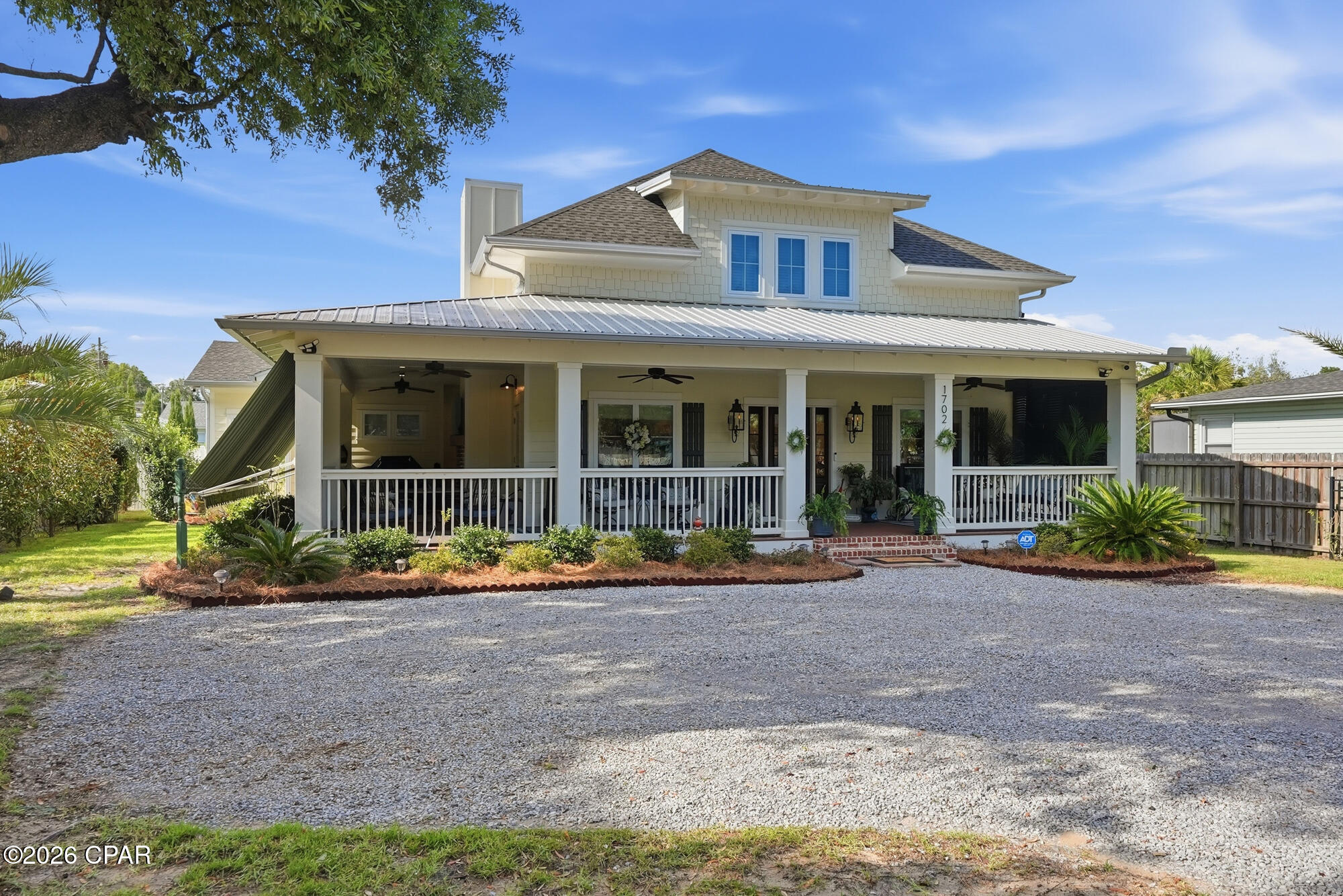 OPEN HOUSE SATURDAY AUGUST 29th 11:00AM - 1:00 PM > CURRENTLY UNDER A CONTINGENT CONTRACT WITH KICK OUT.  Welcome to your dream coastal retreat, beautifully designed around a classic Southern Living floor plan that perfectly blends traditional southern hospitality with a relaxed, modern coastal lifestyle. Located in a quiet bayside neighborhood just off SCENIC BEACH DRIVE with an easy walk to the shoreline and area parks or a quick golf cart trip to the historic ST ANDREWS shops and dining!
Step inside this custom 2019-built home offering 2,900 square feet of meticulously designed space. The beautiful, light-filled living and dining areas immediately impress with rich hardwood flooring, crisp crown molding, and a cozy fireplace that anchors the room. 
At the heart of the home is a CHEF'S KITCHEN  engineered for the culinary enthusiast. It features custom cabinetry, elegant quartz countertops, a massive center island, a gas cooktop, double built-in ovens, and a premium, seamlessly integrated Liebherr refrigerator.
The thoughtful layout accommodates a main floor primary suite that serves as a private sanctuary. It features a fantastic, storage-filled walk-in closet and an attached spa-like bath with a double quartz vanity, a deep soaking tub, and a luxurious walk-in shower. 
Upstairs offers two dedicated guest bedrooms plus two additional large bonus spaces offering   flexibility--perfect for a dedicated home office, playroom or home gym.
Southern living is truly defined by the seamless indoor-outdoor flow. Expand your entertaining footprint with over 700 square feet of wrap-around porches. The spectacular outdoor living space comes complete with a gas fireplace and mounted TV, all shaded by a motorized retractable awning for year-round comfort.Built with ultra-durable, low-maintenance Hardie Plank construction and equipped with a whole-house generator, this coastal craftsman offers ultimate structural peace of mind. Best of all, enjoy complete freedom with no HOA fees, no restrictive rules, and no required flood insurance. This is luxury, convenience, and the ultimate in COASTAL LIVING.