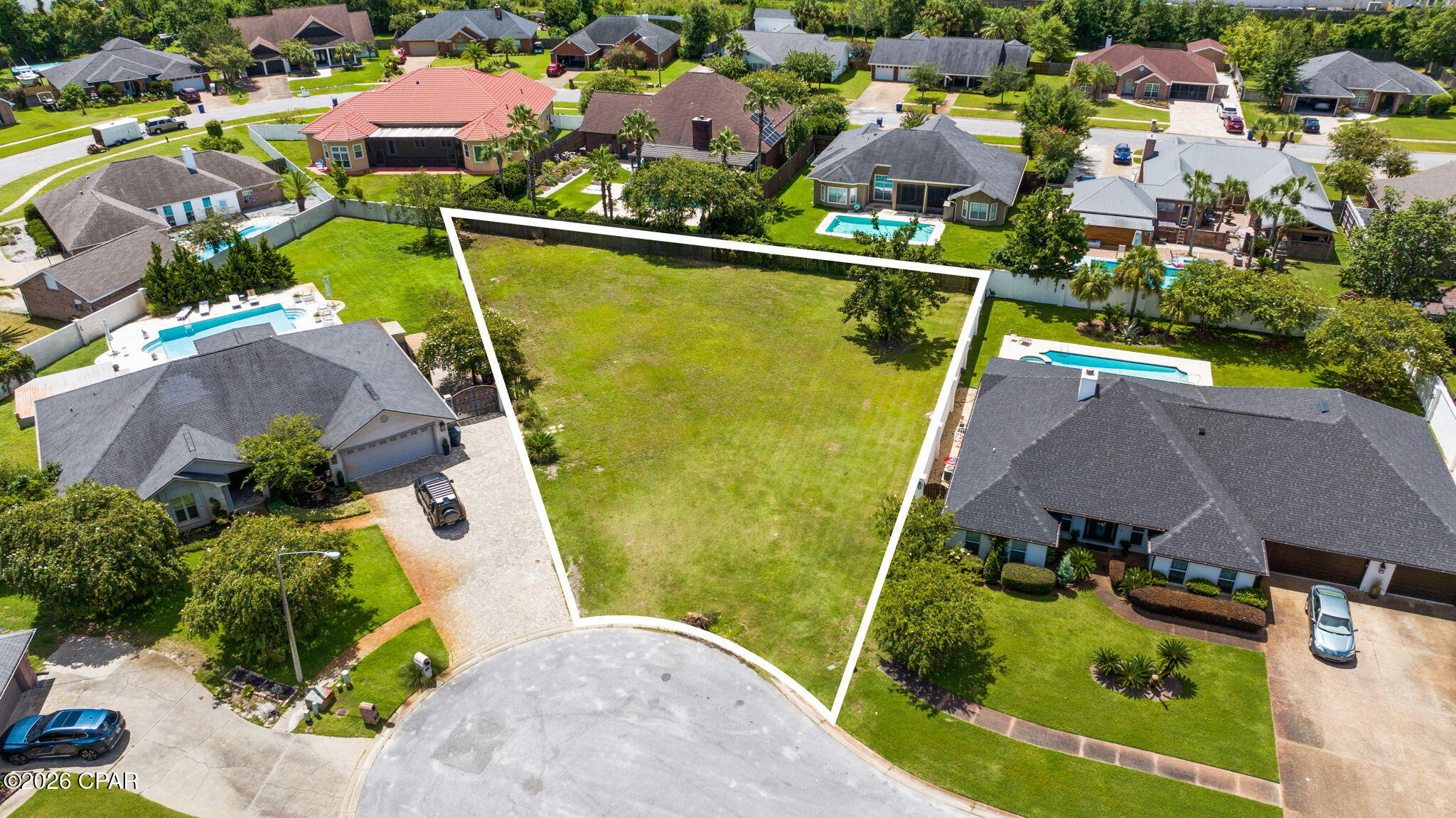 Rarely does an opportunity like this present itself in the established heart of Panama City. Nestled quietly on a cul-de-sac in the desirable Woods II neighborhood, this expansive 0.43-acre property represents the only vacant lot currently available for purchase in the entire subdivision. Enjoy complete freedom with no HOA restrictions or fees, offering you the total autonomy to design and build your custom dream home with your preferred builder on nearly a half-acre of land. Surrounding mature trees and well-maintained neighboring residences provide an immediate sense of community and character that new developments simply cannot replicate, all while keeping you just minutes from 23rd Street dining, shopping, top-rated schools, and medical facilities. Bring your vision and claim the last remaining buildable parcel in Woods II today.