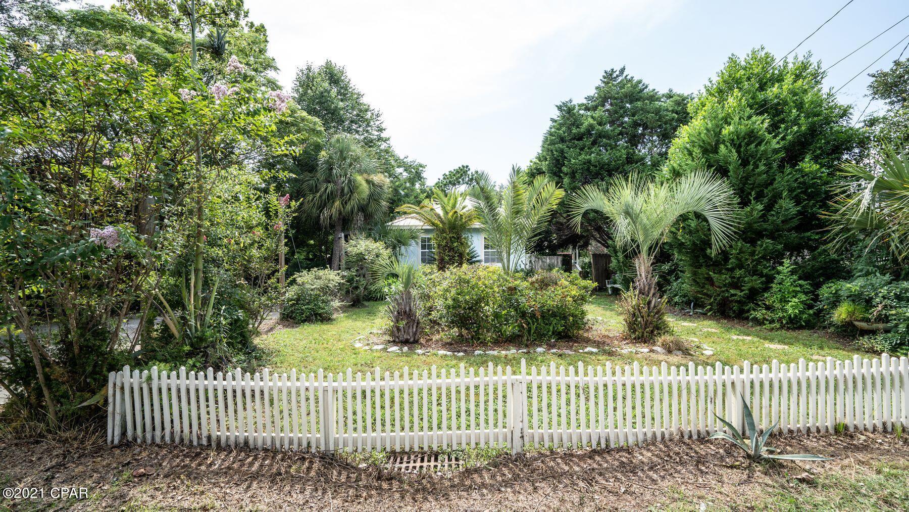 Situated just 1.5 blocks from easy beach access, this quintessential beach cottage has been completely remodeled and sells turn-key ready for immediate enjoyment or rental. Gross rent revenue for 2020 exceeded $37,500 and 2021 YTD income is over $33,300 as of July 19th. Interior features include hardwood floors, all new stainless-steel kitchen appliances, coastal furnishings and décor, and more. The back yard is an inviting outdoor oasis complete with a screened porch, fire pit, and tropical landscaping. The two-level open deck is the perfect place to entertain guests or to unwind and enjoy the coastal breeze. Conveniently located on the west end of Panama City Beach less than 10 minutes from Pier Park to the east and Scenic Hwy 30A to the west.