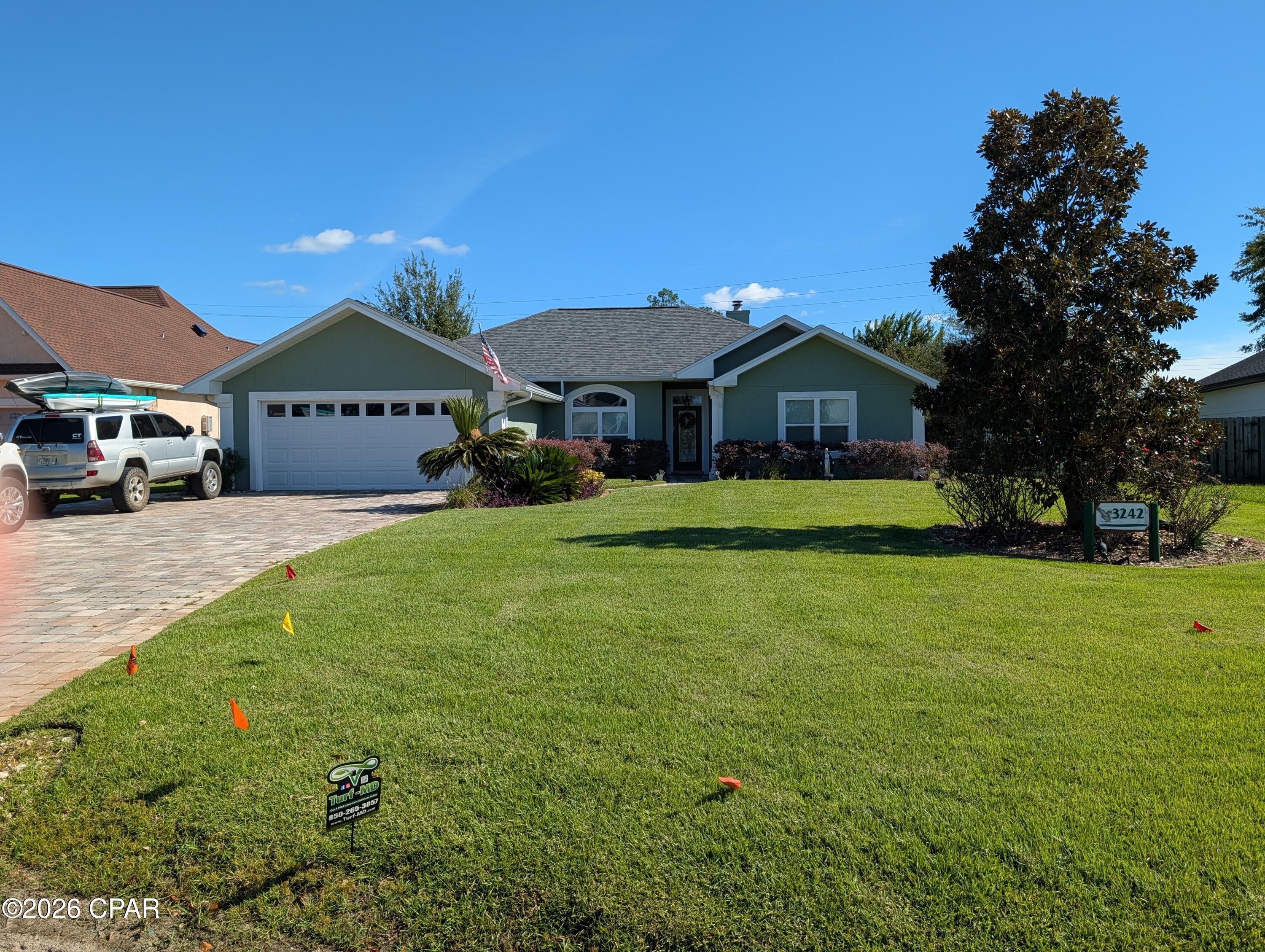 Contemporary and inviting 4 BR home with two baths offering split bedroom floor plan. Big primary bedroom off the kitchen side of house with large closets, spacious master bath with garden tub and big glass shower. Open Living area with gas fireplace, open ceilings, with pass thru opening to kitchen, separate formal dining with nice bay window breakfast nook off kitchen overlooking pool. Pretty wood plank type and tile floors with airy open floorplan. Other wing includes three bedrooms with full hall bath. French doors lead to big screen enclosed covered porch and screen enclosed inground Gunite pool perfect to cool off in on those gorgeous  spring to fall or summer days. Private garden like privacy fenced and lush back yard with doggie door access. Two car garage off the separate laundry room. Paver driveway, and paver deck around pool.