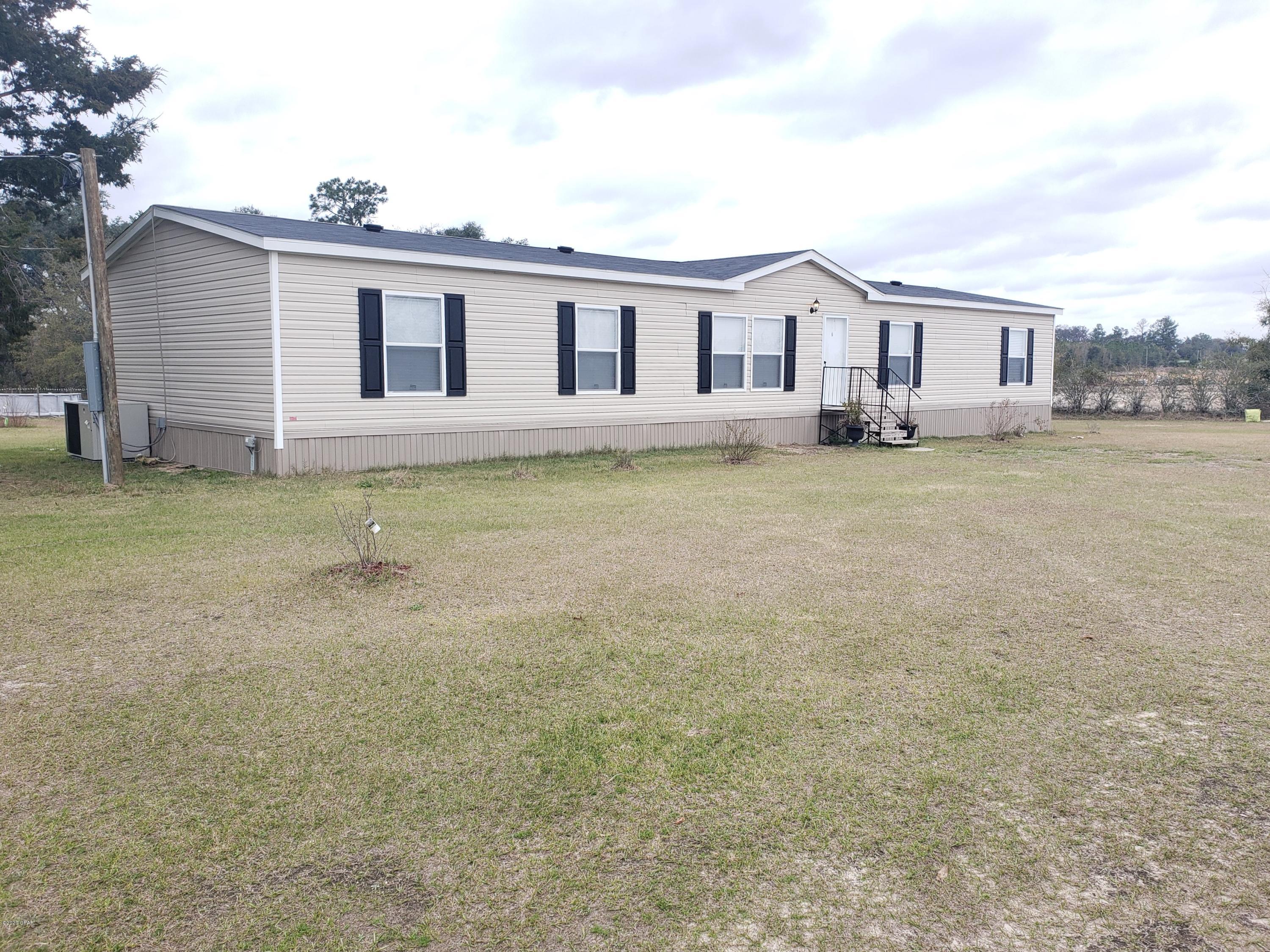 2019 4/2 Double wide on 1 acre in Malone on a quiet country road!! If you are looking for a move-in ready home with peace and quiet, this is your place! Home has a big open kitchen with custom barn wood accent walls and two living areas. The master bedroom has an attached study that would be perfect for an office or nursery. Easy to show, make your appointment to see it today! Still under warranty and has a current survey!