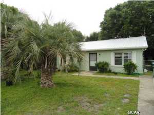 ''JUST REDUCED $5,000.00'' WALK TO THE BEACH from this cozy 2 Bedroom one bath home situated on a level shaded lot with fenced in back yard . This property also features a 12x14 detached Guest suite with a/c and bath room facilities that would make a perfect place for weekend visitors as well as an 8x10 storage shed. Inside the home there are 2 spacious bedrooms . The entire home has tile flooring. It also features a large open living room. This home is perfect for first time home buyers , or would be great as a beach retreat convenient to all that Panama City has to offer. Owner states that a new metal roof was installed in September of 2013. ALL MEASUREMENTS ARE APPROXIMATE AND SHOULD BE VERIFIED IF IMPORTANT.