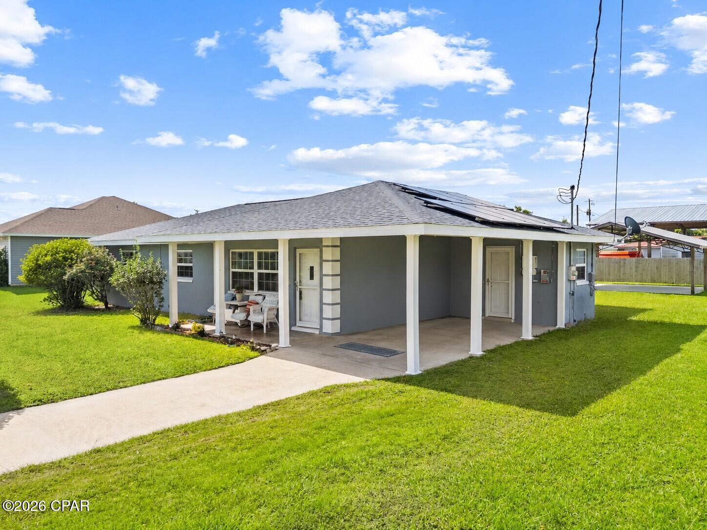 Well-maintained and ideally located near Tyndall AFB, this charming 3-bedroom, 2-bath home offers comfortable living, valuable outdoor space, and an incredible energy-saving bonus! Situated in a well-established neighborhood known for its large yards and great neighbors, this home offers the space and setting you've been looking for.

Inside, you'll find a functional layout featuring a spacious living room plus a separate den, providing plenty of room for relaxing, entertaining, working from home, or creating a flex space to fit your needs. The home has been lovingly maintained and is ready for its next owner.

One of the biggest highlights is the solar panel system, offering the potential for improved energy efficiency and reduced electricity costs. Even better, the solar lease will be completely prepaid for the next 24 years, giving the new homeowner a tremendous long-term benefit without the burden of making solar lease payments for the next quarter century! This is a rare opportunity to enjoy the advantages of solar while adding significant value and peace of mind.

Step outside and the possibilities continue! The spacious backyard features a large pole barn, perfect for storing a boat, recreational equipment, vehicles, tools, or all your outdoor toys. A separate storage building provides even more room for organization and storage.

Conveniently located close to Tyndall AFB, this home combines a great location with a spacious yard, excellent storage, a flexible floor plan, and 25 years of prepaid solar benefits. Don't miss this opportunity to own a well-maintained home with features that truly set it apart!