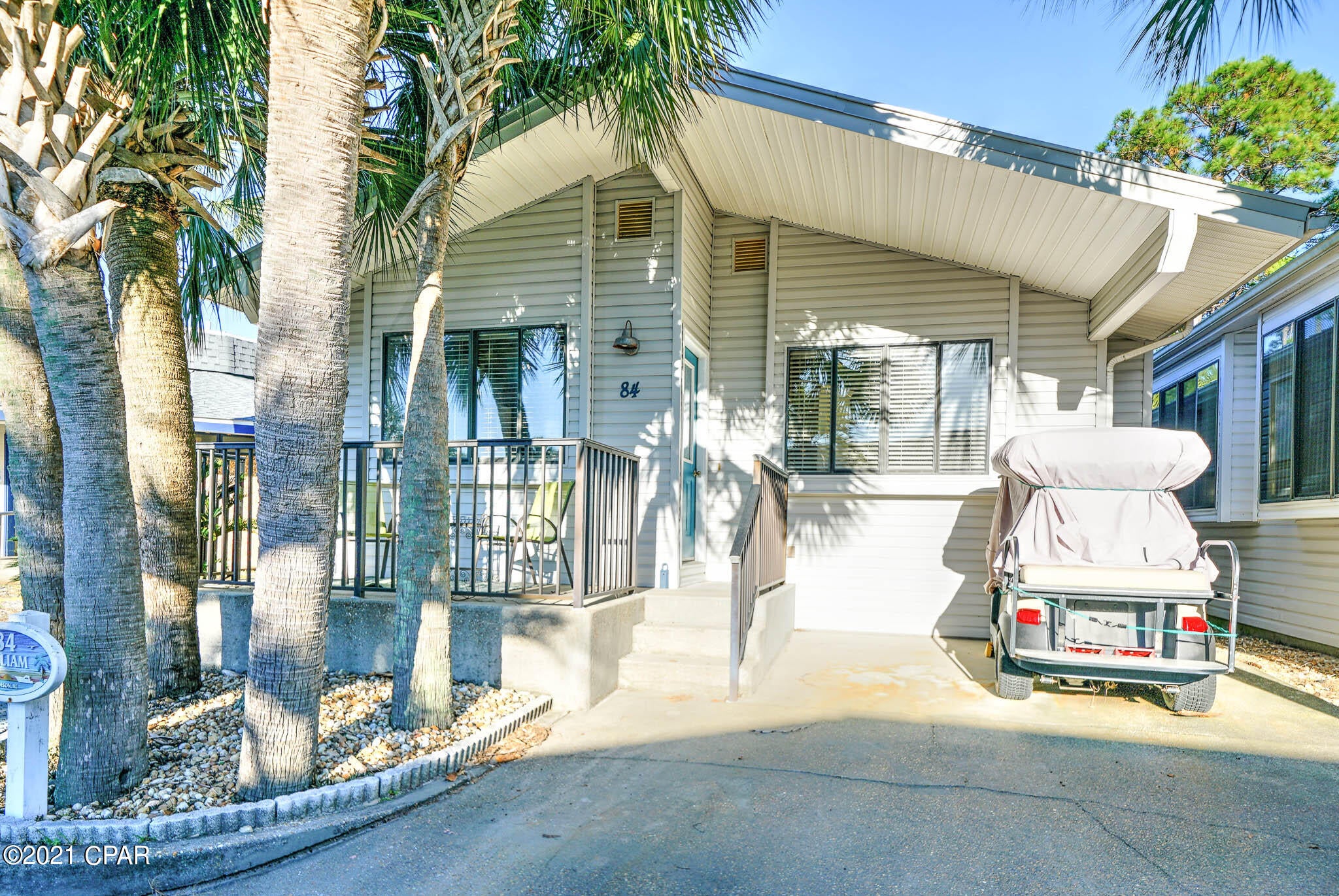 CURRENTLY UNDER CONTRACT, SELLER ACCEPTING BACKUP OFFERS - Rare opportunity to own this magnificent Venture Out home that backs up to St. Andrews State Park! This beautiful 3 bedroom, 2 bath has a great open floor plan and flows beautifully! The kitchen is large and open to the living room. This home also boasts a separate dining room which gives you that extra space for entertaining. A new metal roof was installed in 2019. Home will be sold furnished and ready to go!  The best part of all is the stunning views of St. Andrew's State Park. Watch the deer come up while relaxing after a day on the beach. Venture Out is a golf cart community that has exploded with popularity recently.. With 300' on the beautiful pristine beaches of the Gulf of Mexico and 1,000' on the G