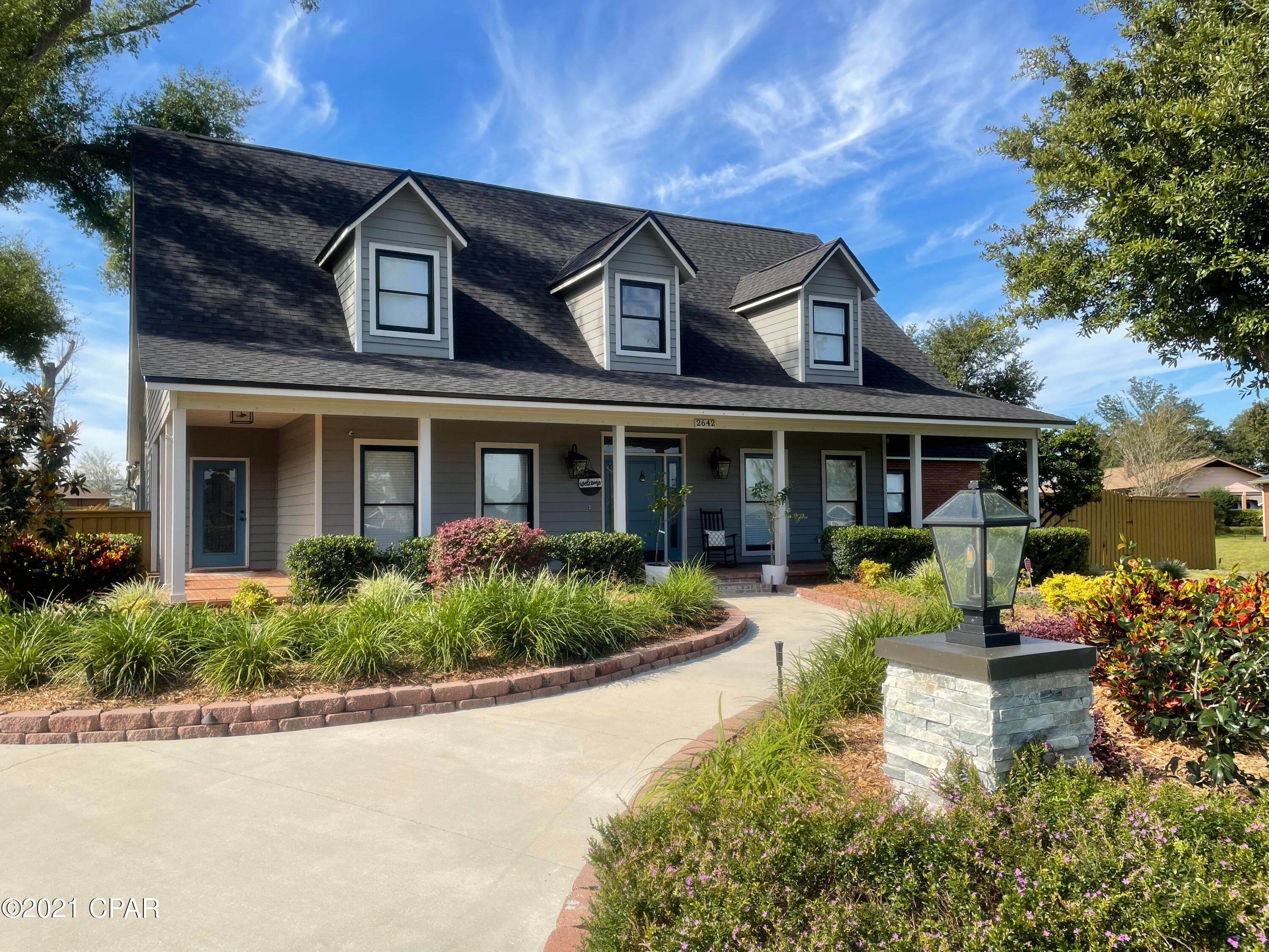 CURRENTLY UNDER CONTRACT, SELLER ACCEPTING BACKUP OFFERS.  Imagine sitting on your exquisite brick floored, columned, wrap-around front porch viewing the rolling hill lawn across from Mill Bayou in College Point. This elegant home has so many features you will want to make your own! The Entry foyer rises to 20 ft. with a picturesque photo ready stairway landing to bedrooms. Enter the lovely great room with travertine floors, oversized masonry fireplace, 10 ft. ceilings & recessed lighting. A mirrored bar tucked in to serve guests with wine cooler fridge. Adjacent to the kitchen & breakfast area through French doors is the formal dining room & unique chandelier.French doors on both sides of the fireplace lead to the multi use Florida room viewing the fantastic pool & recreation area. The kitchen centered by a cooktop island with black granite counters as well as a pantry & desk for computers or menu planning. The hall leading to the garage & pool area is lined by huge closets for storage of all kinds & a spectacular laundry room for a completely organized family! The hall leads to a covered back porch for grilling adjacent to the super pool & patio area. On top of all the outstanding features in this home, the outstanding very large master bedroom & decorator designed suite, his & her sinks & custom vanities, free standing tub, 2 person 5 x 6 shower with body jets alone are worth the viewing.  Your key coded electric gate will lead you to the three car garage with shop and extra parking for your golf cart.  Enjoy the relaxing days in the picturesque three quarter acre back yard.  Normandale Estates is tucked away in College Point and is one of the most sought after areas in Bay County.