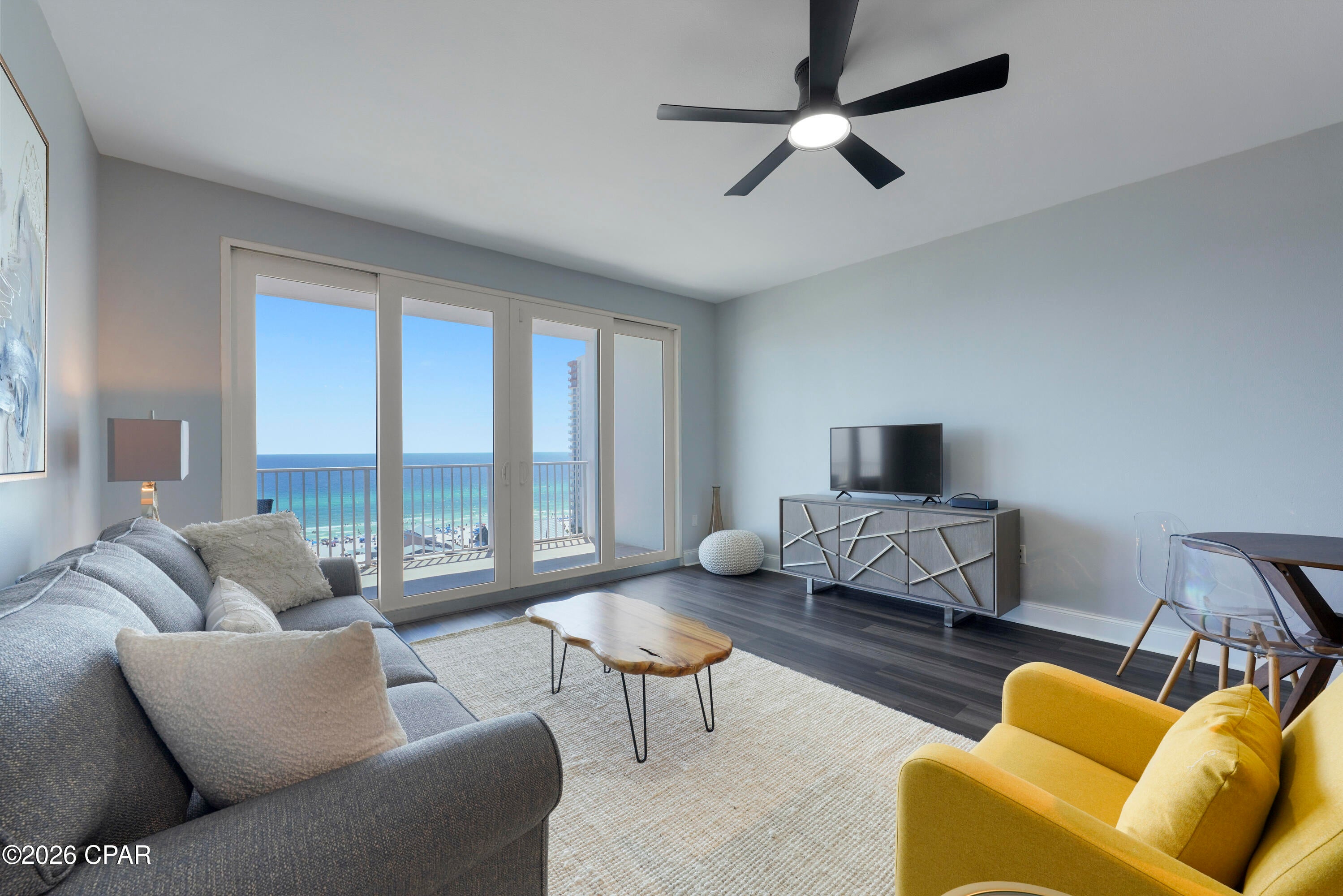 Beautifully updated 2-bedroom, 2-bath condo with a bunk room and Gulf views at Laketown Wharf! This spacious residence sleeps 8+ and features an open floor plan, expansive balcony, granite countertops, breakfast bar and a private primary suite with double vanity, garden tub and separate shower. Standout upgrades, Gulf views and a prime location at Laketown Wharf! 

Unit 1123 is a beautifully reimagined with wall-to-wall luxury vinyl plank flooring and a polished mid-century-meets-coastal-chic design.The fully updated kitchen elevates this residence with premium granite countertops, modern cabinetry, upgraded lighting and premium stainless-steel appliances. The redesigned primary bathroom feels like a private retreat, featuring a spacious walk-in shower with premium wall tile, an updated dual vanity, upgraded lighting, gold accents and a classic soaking tub.

Step onto the expansive balcony for a Gulf view overlooking Pineapple Willy's and stretching east along the coastline. The spacious open floor plan comfortably accommodates eight or more guests, making the unit equally appealing as a beach getaway or vacation-rental investment.

Located across from the beach, Laketown Wharf offers five pools, convenient beach access, a Gulf-view fitness center, kids' playground, covered parking, on-site dining and a 52,000-square-foot lakefront boardwalk with a nightly fountain and light show. Shopping, dining and entertainment are just minutes away.