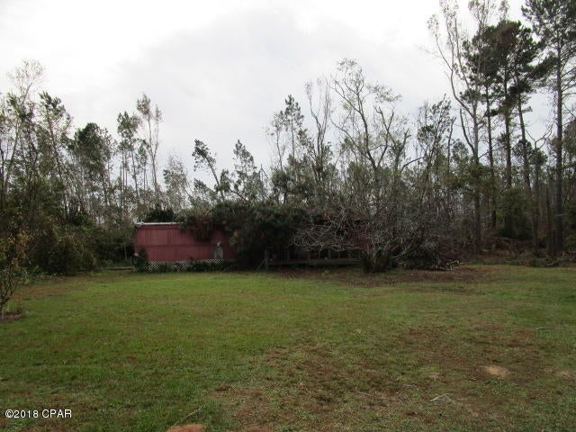 1.4 acres with older damaged single wide.  Power pole, septic and county water in place.  Across from public boat ramp road and a minute from national forest.