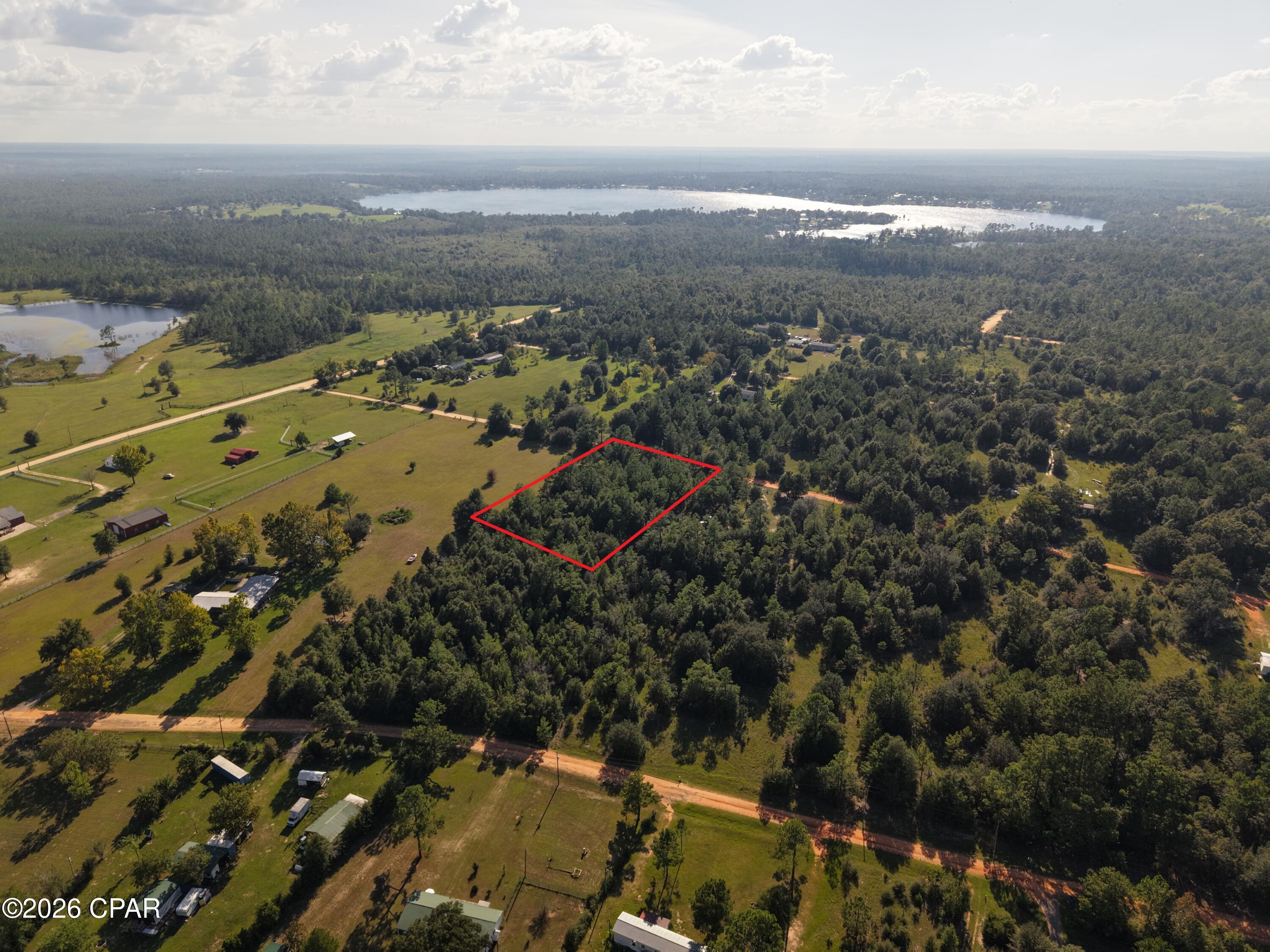 Build your dream home in the peaceful Highlands of Compass Lake in the Hills! This vacant residential lot is located on Kuwait Lane in an established neighborhood, offering a quiet country setting with plenty of natural beauty and room to create a place of your own. Double-wide mobile homes are allowed, giving you additional flexibility when choosing your future home.

Property owners have the option to participate in the voluntary HOA, which provides access to community amenities for those who choose to join. Enjoy the relaxed lifestyle of the Compass Lake area while still being within driving distance of Marianna, Panama City, and the beautiful beaches of Northwest Florida.

SELLER FINANCING AVAILABLE, making this an excellent opportunity for buyers looking for flexible purchasing options. Whether you're ready to build now or looking for an affordable piece of Florida land to hold for the future, this lot is worth a look!