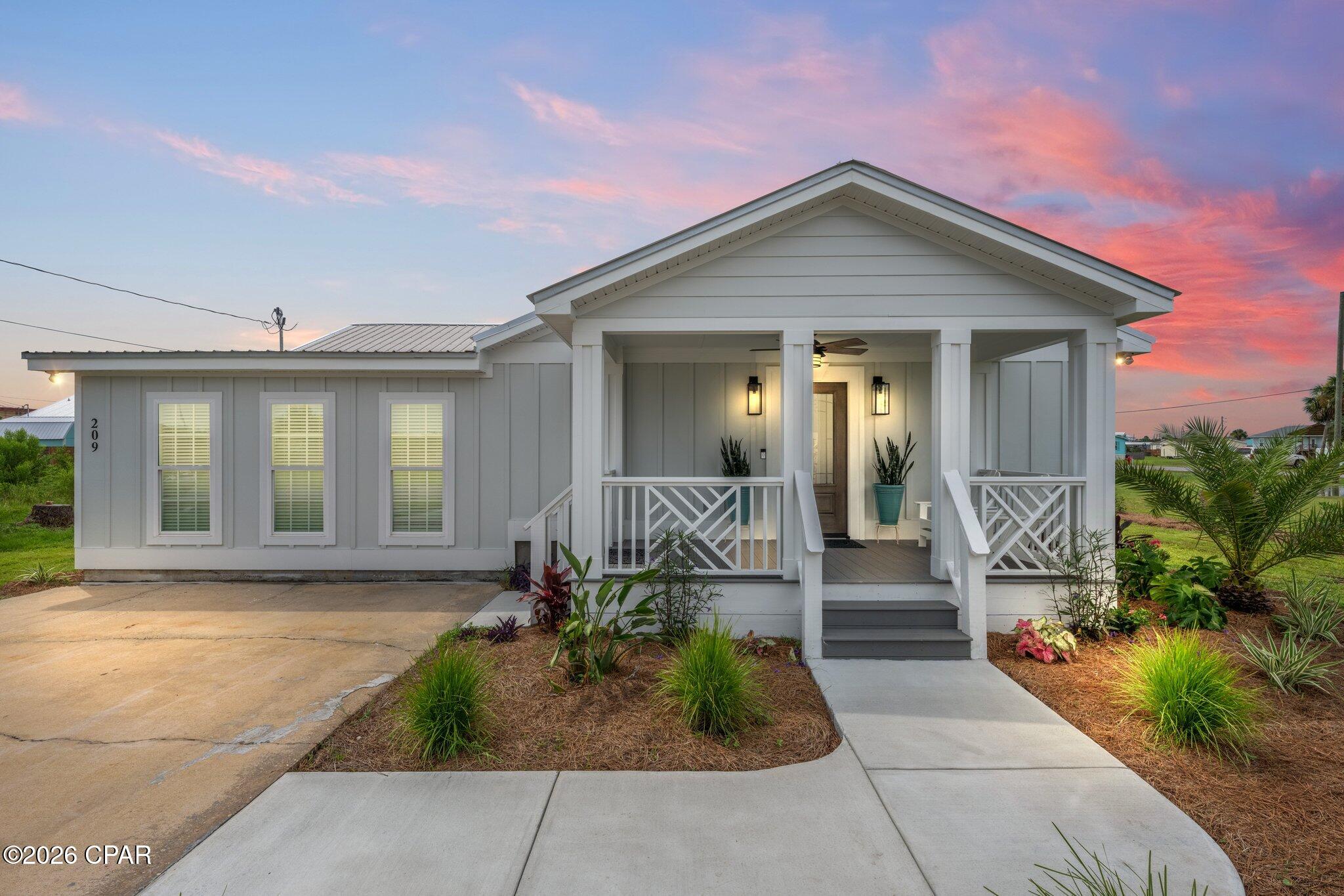 BEACH DAYS AWAIT!! Discover the laid-back charm of Mexico Beach at 209 7th St, a beautifully updated 5 bedroom/3 bath coastal retreat offering plenty of room for family & friends. Just two blocks from dedicated beach access, this inviting home combines comfort, convenience & the relaxed lifestyle that makes Mexico Beach such a special place. Step inside to a bright, welcoming interior with updated finishes & a spacious layout designed for everyone to spread out while still enjoying comfortable gathering spaces. The kitchen is at the heart of the home with a center island, ample workspace & an open connection to the living areas, making everything from casual beach-day lunches to fresh seafood dinners easy & enjoyable. Updated flooring, recessed lighting & refreshed finishes throughout create a comfortable coastal feel that's ready to enjoy. Outdoor living adds even more appeal with a covered front porch that's perfect for morning coffee or relaxing in the coastal breeze. Out back, the open deck & fully fenced backyard create a fantastic setting for grilling, entertaining & soaking up the Florida sunshine while children & pets have plenty of room to play. A large backyard storage building provides valuable space for beach chairs, bicycles, fishing gear, paddleboards & all the extras that come with coastal living. The owners have also made a significant investment in a professional under-home encapsulation system designed to help control moisture, an especially valuable improvement in a coastal environment. Another great advantage is the home's location in the desirable X Flood Zone, considered an area of minimal flood risk where flood insurance is typically not required by mortgage lenders--an attractive benefit that may offer significant annual savings compared with properties in higher-risk coastal flood zones. Best of all, the sugar-white sand & beautiful waters of the Gulf are just a short stroll away. Spend your mornings walking the shoreline, afternoons swimming, fishing or boating & evenings taking in spectacular sunsets. Known for its uncrowded beaches, incredible fishing & welcoming small-town atmosphere, Mexico Beach offers a refreshingly easygoing way of life where sunshine, saltwater & time spent together take center stage. Fully updated, spacious & ready for its next chapter, 209 7th St is designed for making lasting beach memories--from morning coffee before heading to the Gulf to backyard cookouts with the whole crew & evenings enjoying the coastal breeze. Call for your private tour & LIVE THE BEACH LIFE!