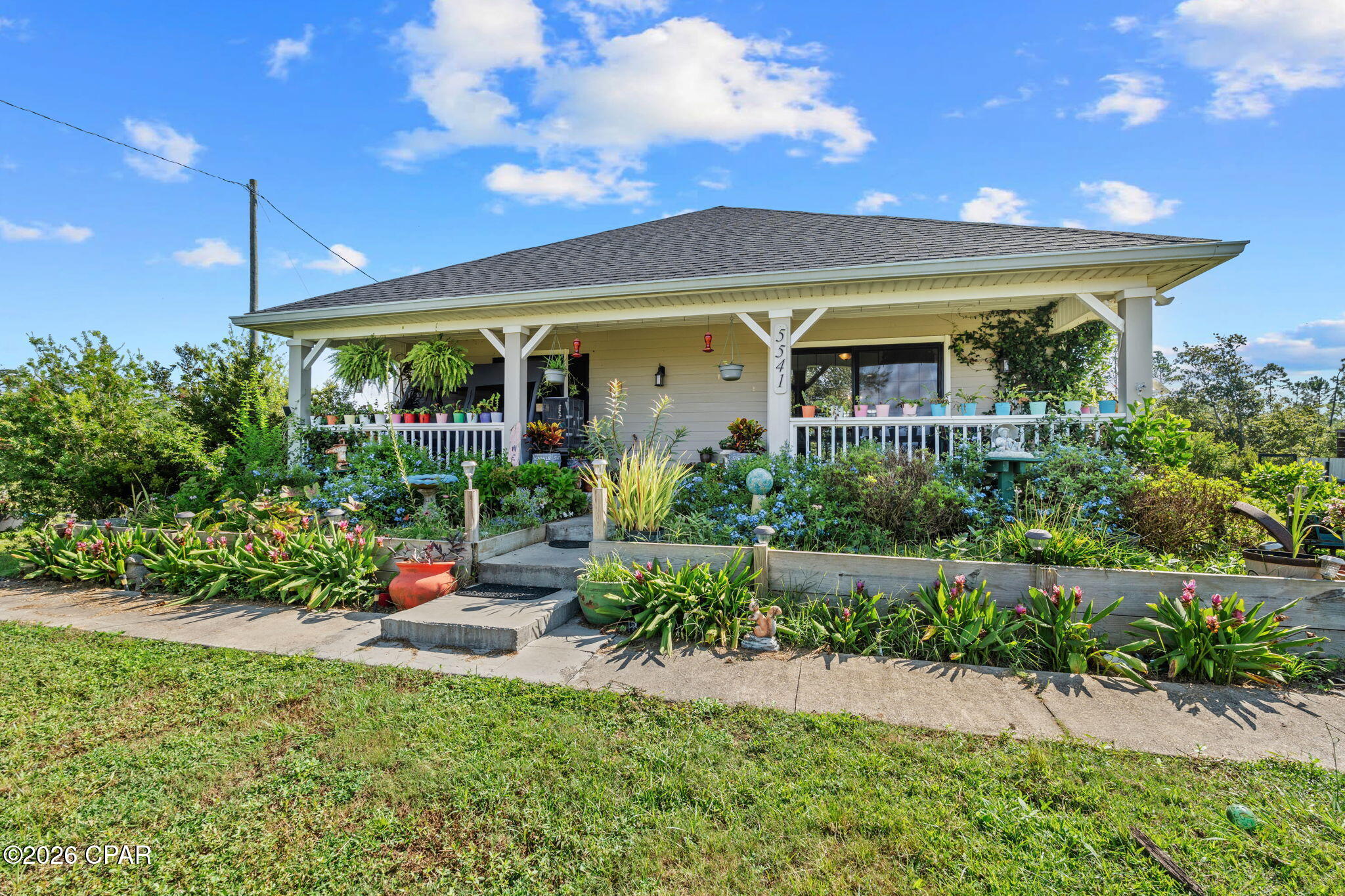 COUNTRY LIVING MEETS EAST BAY VIEWS! Built in 2020 and perfectly situated on 1.75 acres with NO HOA, this beautiful home offers the space, privacy, and flexibility you've been looking for. Enjoy breathtaking sunsets over East Bay from the expansive full front porch, creating the perfect spot to unwind at the end of the day.
Inside, the thoughtfully designed split-bedroom floor plan provides both comfort and privacy. The kitchen features stainless steel appliances, a gas range/oven, and plenty of workspace for everyday living and entertaining. The home is also equipped for a whole-house generator hook up, offering added peace of mind.
Outdoor enthusiasts will appreciate the 10-foot deeded water access to the Bay, providing an incredible opportunity to enjoy the water just beyond your doorstep. Additional property improvements include a new deep well installed in 2020, new septic system installed in 2024, and a tankless water heater.  And then there's the approximately 23' x 60' pole barn a truly versatile bonus space ready to become whatever you need it to be. Use it for animals, a workshop, equipment, hobbies, or bring your own vision to life.

With a newer 2020 construction, acreage, Bay access, stunning sunset views, no HOA, and an impressive amount of additional storage and workspace, this property offers a rare combination of privacy, functionality, and the laid-back Florida lifestyle.