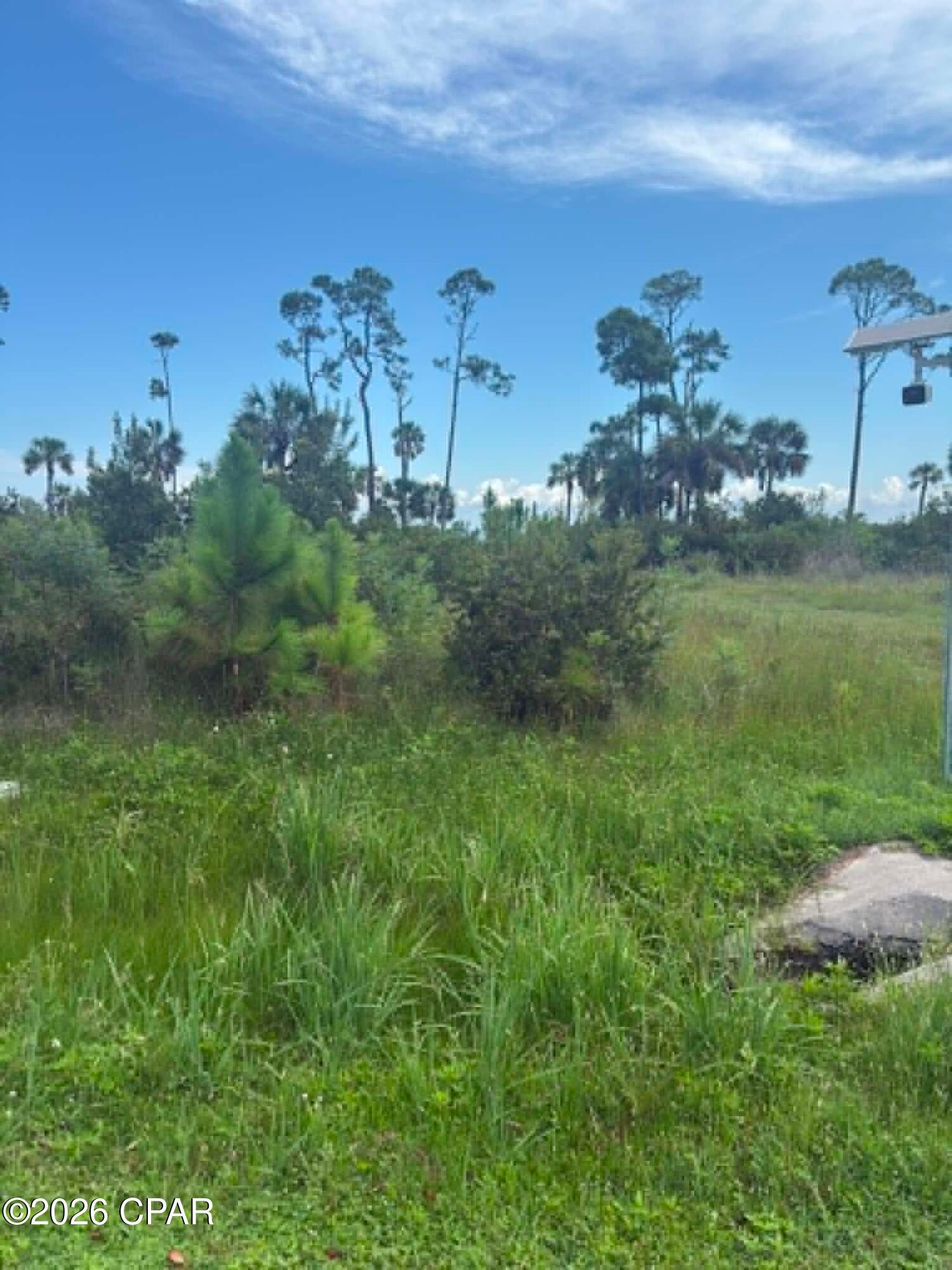 Platted bayfront building lot with outstanding views of the head of St Joseph's Bay and Black's Island. This lot has minimal marsh grass in front of it and therefore would have easier access to scalloping, kayaking, paddle boarding and small craft boating. Easy access to Salinas Park for legal driving access to the beach and all of the south Cape. Lot is currently not subject to the Villa Del Sol HOA and was pulled out of the development years ago. A portion of the flood zone is AE and VE. The Villa Del Sol HOA would consider membership for access to amenities. Some dimensions were obtained via the Gulf County Property Appraiser's website. Please verify if important.
