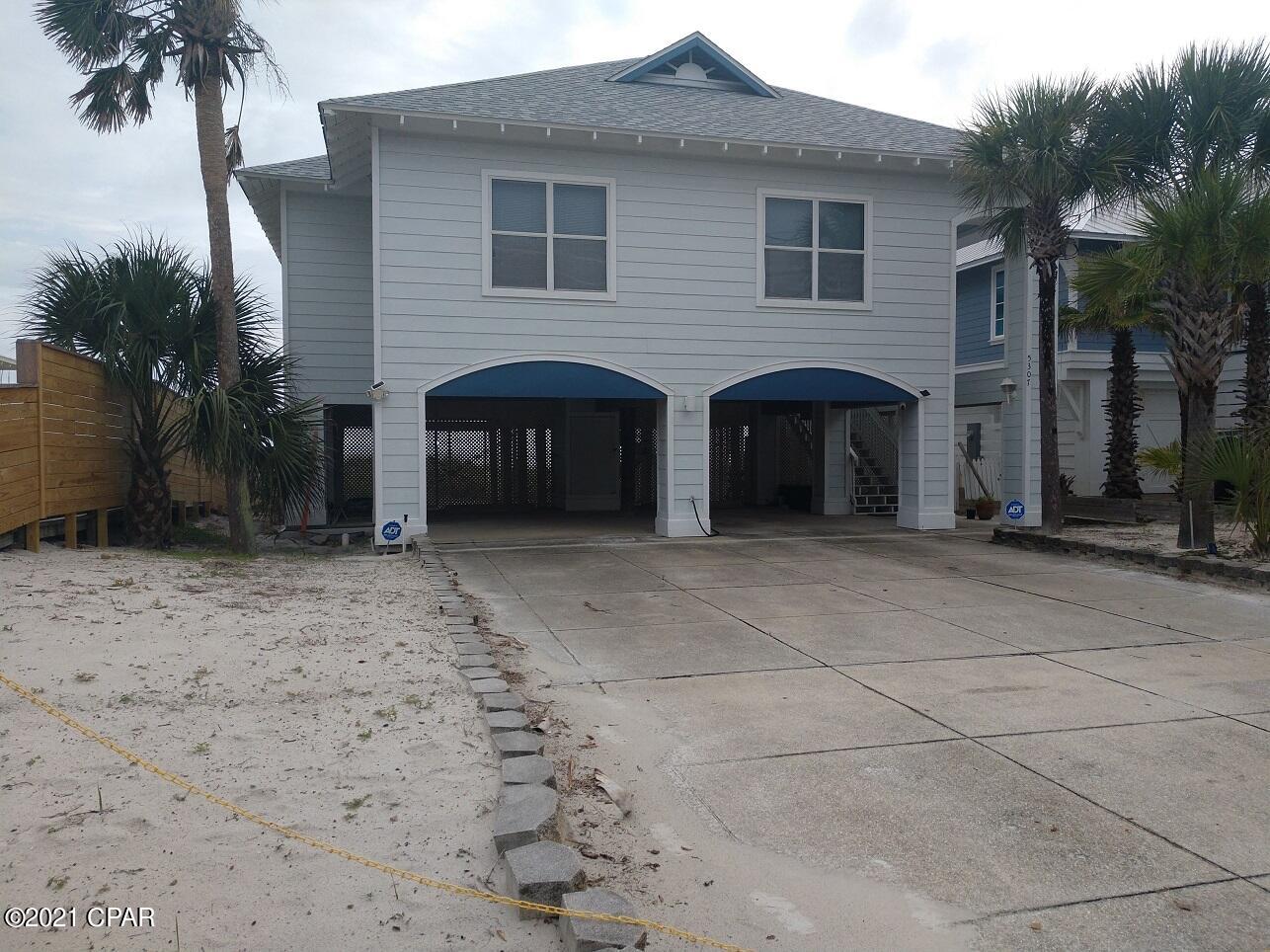 Currently under contract -Back up offers accepted. Great Gulf front home on Private Gulf Drive within walking distance to St. Andrews State Park and Schooners. This premier location is just a short distance to many amenities. Boat rentals, and many great local favorite restaurants. The home has everything needed to create a great second home or investment rental property. The home can currently sleep approximately 12 to 14 people and park 6 vehicles. The house features an open floorplan great for entertaining and the entire back of the home is windows and full glass doors overlooking the magnificent Gulf beach. The property has been a private residence and has no rental history. The home has 10' ceiling's throughout. Owner willing to contribute $100k with full price offer towards upgrades.