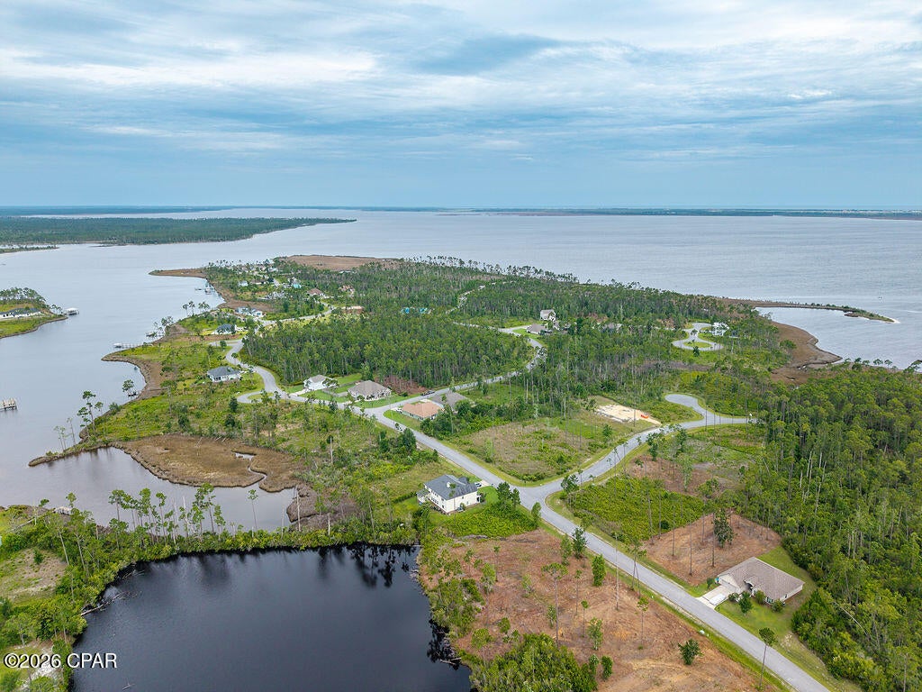 Build your dream home in the highly sought-after Laird Point!  With water, sewer, and electric ready to connect, you're one step closer to bringing your vision to life.

Just a short distance to the tennis courts, this gated waterfront community offers the lifestyle buyers are looking for--complete with underground utilities, RV and boat storage, and surrounded by stunning custom homes.

Opportunities like this don't last--come experience Laird Point for yourself and schedule your visit today!