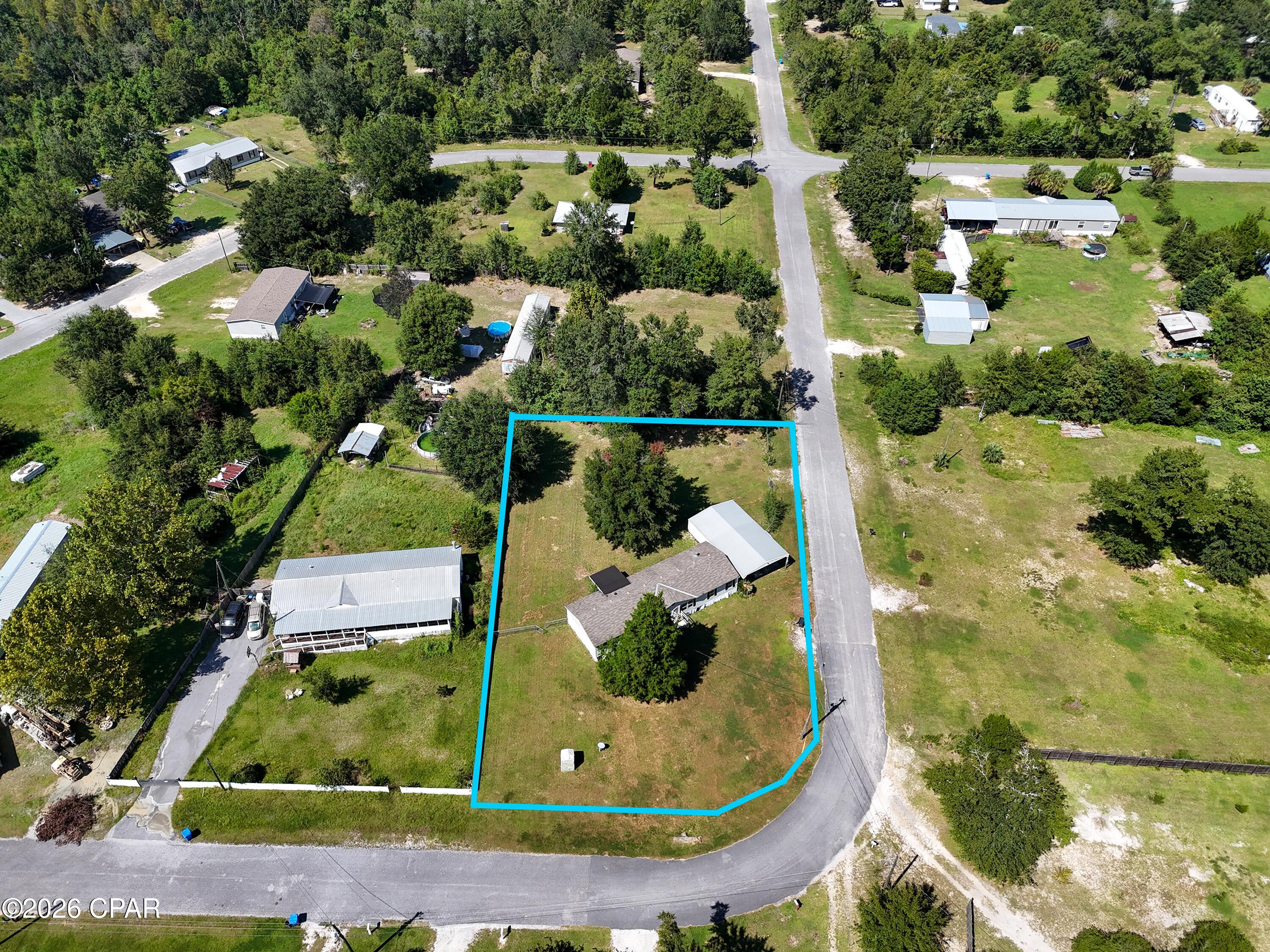 Home on over 1/2 Acre! Large mobile home with good bones. Code Violations are present and property is ready for immediate sale. Cash Only! Carport and Shed are part of violation and being removed. Additional structure added on to home is also in need of removal and new roof shingles on home extend further than code allows. No appliances are present and majority of electrical is missing. All code violations must be remedied by buyer and code case will not be closed out at time of sale. Call listing agent for more details and information.