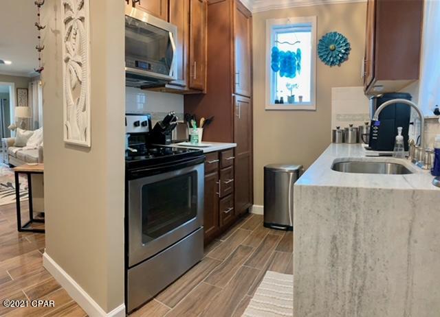 Multiple Offers - Deadline Thursday 5:00 July 15. Here it is... Cute BEACH GETAWAY right across from the Beach. You will love this 1 BR with a Bunk Room and 1 Bath that Overlooks the POOL. Whether you want the BEACH or the POOL, you are only steps away. You CAN do Short Term Rentals. NO LONG TERM RENTALS ALLOWED. Owners can have Pets. Laundry Room on-site. Building has a New Roof '2020 & New Windows. This is an END UNIT so it has EXTRA WINDOWS on the Side of the unit. Roof, HVAC, Frig, Stove, DW, WH are all 2 years old!!! The following items do not convey with the Sale... Hanging Swing Chair in LR, Personal Pictures, personal items, clothes, vacuum, glasses in bar cabinet, Beatles Quote in Picture in the Hall.  Age, SF, and Dimensions are approximate... please verify if Important.