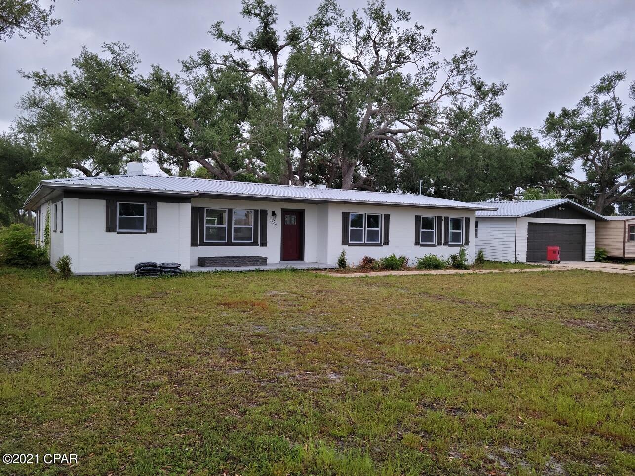 This home has had a completes remodel from the new metal roof down. All new windows, new cabinets and granite counters in kitchen and bathrooms. New LVP floors throughout. The home shows beautifully, and after all that the property has excellent westerly views to the Bay. The large lot has Large Oak trees creating plenty of shade. Solid concrete block and separate garage. The property sells itself.