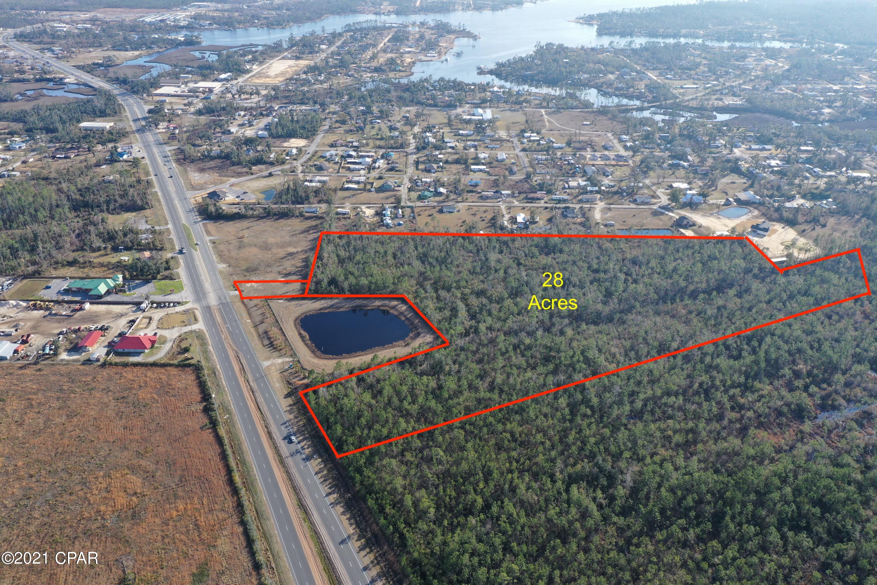 Great 28 acre commercial parcel with two entrances on Hwy 77.
