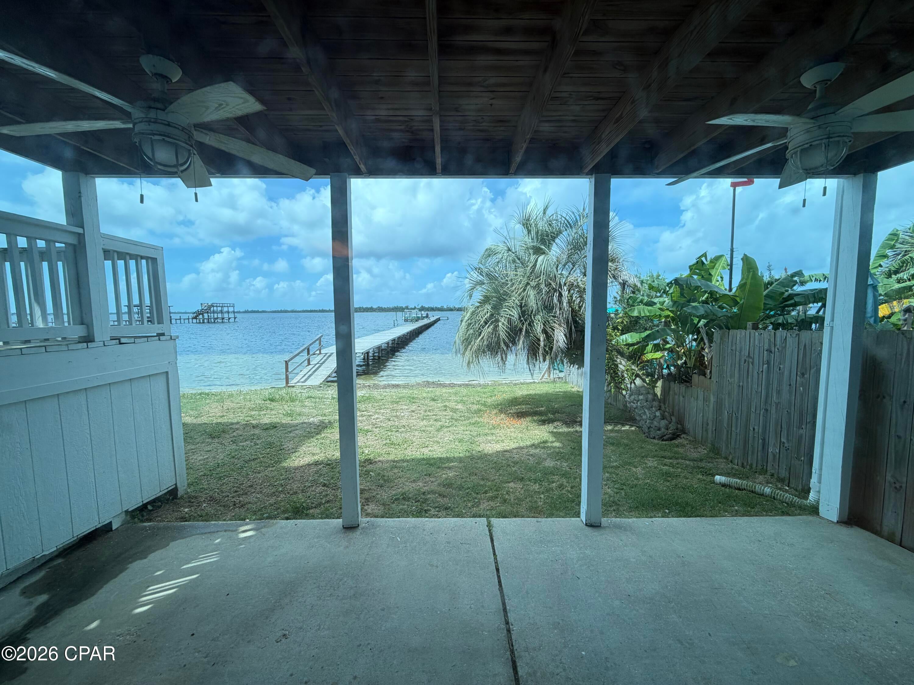 **COMING SOON LISTING, NO SHOWINGS**
Incredible views from this Bay Front 3 bedroom 2.5 bath Townhome with 1 bedroom 1 bath mother-n-law apartment on ground floor. Did I mention the amazing wide open bay views? Boat dock is almost directly in front of this unit each owner has 1/11th deeded ownership, NO HOA fees. The main living unit has a really great split level floor plan. Drive up parking for 2 cars. Enter the unit on living room level featuring large living dining combo with balcony access overlooking the dock and bay. Kitchen and half bath also on this level. Head downstairs to your primary bedroom with amazing views of the bay. Just down the hallway you'll find 2 guest bedrooms, a shared full bath, and full size laundry. Head down the exterior stairs to access your full mother-n-law apartment with 1 bedroom, 1 bath, full laundry. A galley style kitchen and again amazing views of the Bay from living room w/ covered porch area off the living space. This townhome has many of the costly upgrades you want to see in your next property.
