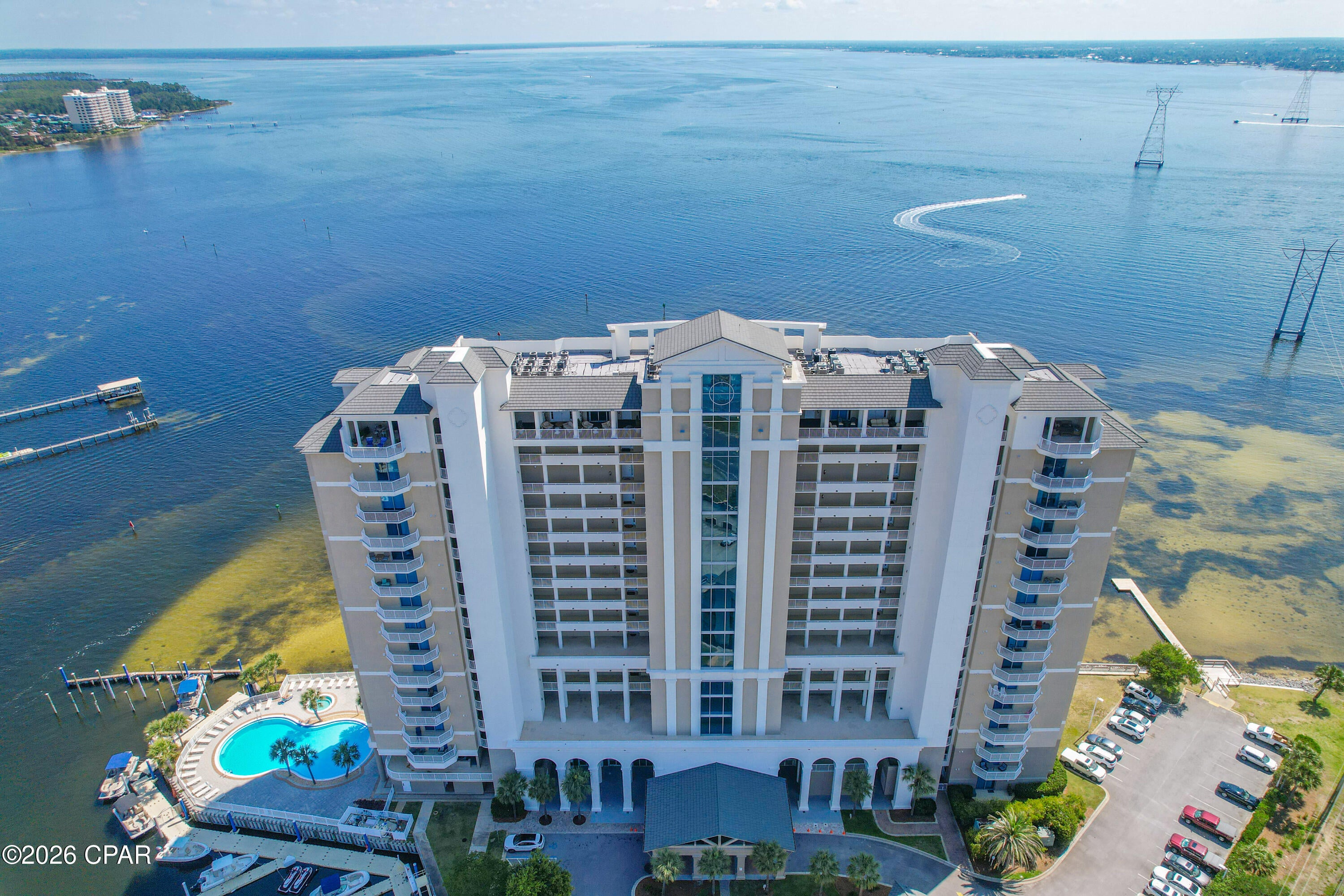 Luxury Waterfront Condo at Marina Landing! Paradise awaits in this beautifully appointed 2-bedroom, 2-bath residence at the highly sought-after Marina Landing. With two private master suites, each featuring waterfront views and balcony access, the split floor plan provides both comfort and privacy.
The expansive floor-to-ceiling sliders open to a massive balcony where you can enjoy breathtaking water views from every room. Lithium powered blinds for sliders in living room to provide shade, all main and wet areas tile. The balcony also includes a built-in grill, perfect for outdoor entertaining. 

Interior highlights include:

New air conditioning system 2026,  Dishwasher and Fridge 2022,  Water heater 2018 with washer and dryer. Recessed lighting, newer faucets, fixtures and hardware unit's interior freshly painted all neutral. 

Resort-style amenities at Marina Landing include:

Private deep-water marina available for boat owners with quick access to the Gulf

Stunning bayfront pool and hot tub

Fitness center and conference room

Exterior owner storage closet.

The Landing has recently completed a resurfacing of the  main exterior portions of the building giving the building a fresh exterior elevation

Covered assigned parking space (#3), first floor ramp parking visible from front balcony all extraordinary for convenience.

This is more than a condo--it's a lifestyle. Don't miss your opportunity to experience the very best in waterfront living.