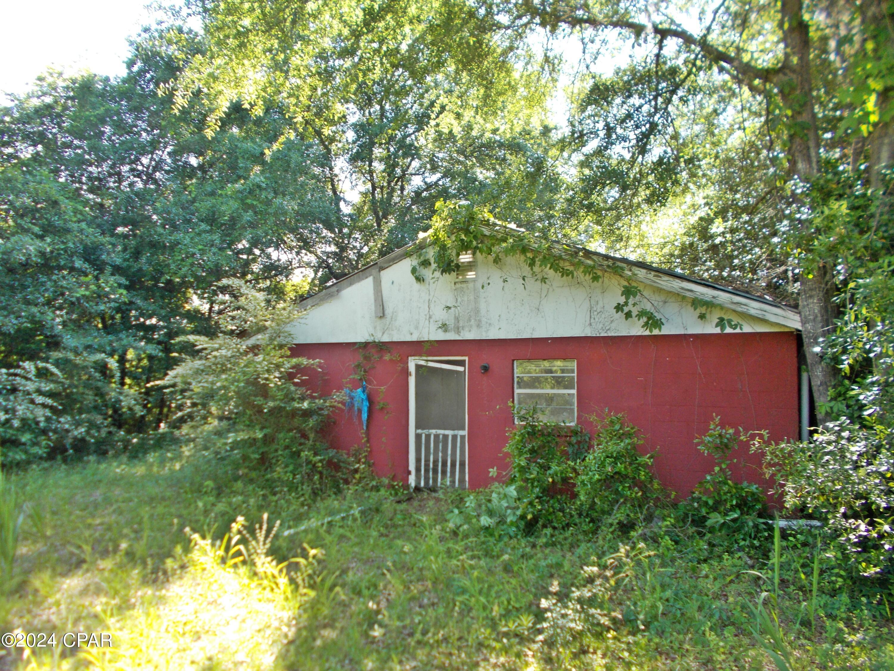 Barn dominium lovers with space for a nice garden or some animals, no restrictions on this property, there is also additional acreage available. There are some beautiful live oaks. Drive by and look at it.