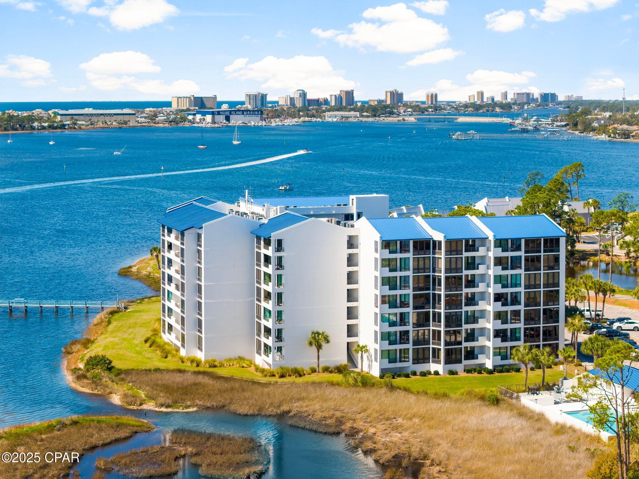 Welcome to peaceful coastal living in the gated community of Bay Point.  This bright and inviting 1 bedroom condo in Lagoon Towers offers beautiful water view and a relaxed lifestyle.  Enjoy morning coffee on the balcony overlooking the pool, lagoon, the pass to the Gulf, Bay Point Golf Course and unwind in the quiet surroundings that make Bay Point one of the most desirable residential communities in Panama City Beach.  Perfect as a primary residence, second home, or long term rental investment property. Residents enjoy a wide range of amenities including a waterfront pool, dock access, bike room, and additional storage.  The monthly HOA fee of $605 includes water, trash service, cable TV, internet, pool, dock access. making ownership simple and convenient.  Located just minutes from boating, golf, dining, and the beautiful beaches of the Emerald Coast and close to the renowned Bay Point Marina.  Vacant and easy to show.  New reduced price!