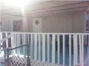 West end of the beach, 2 bedroom 1 bath mobile home located just a short distance from the beach. Fenced in yard with an extra storage building and nice porch to relax on. New carpet throughout.