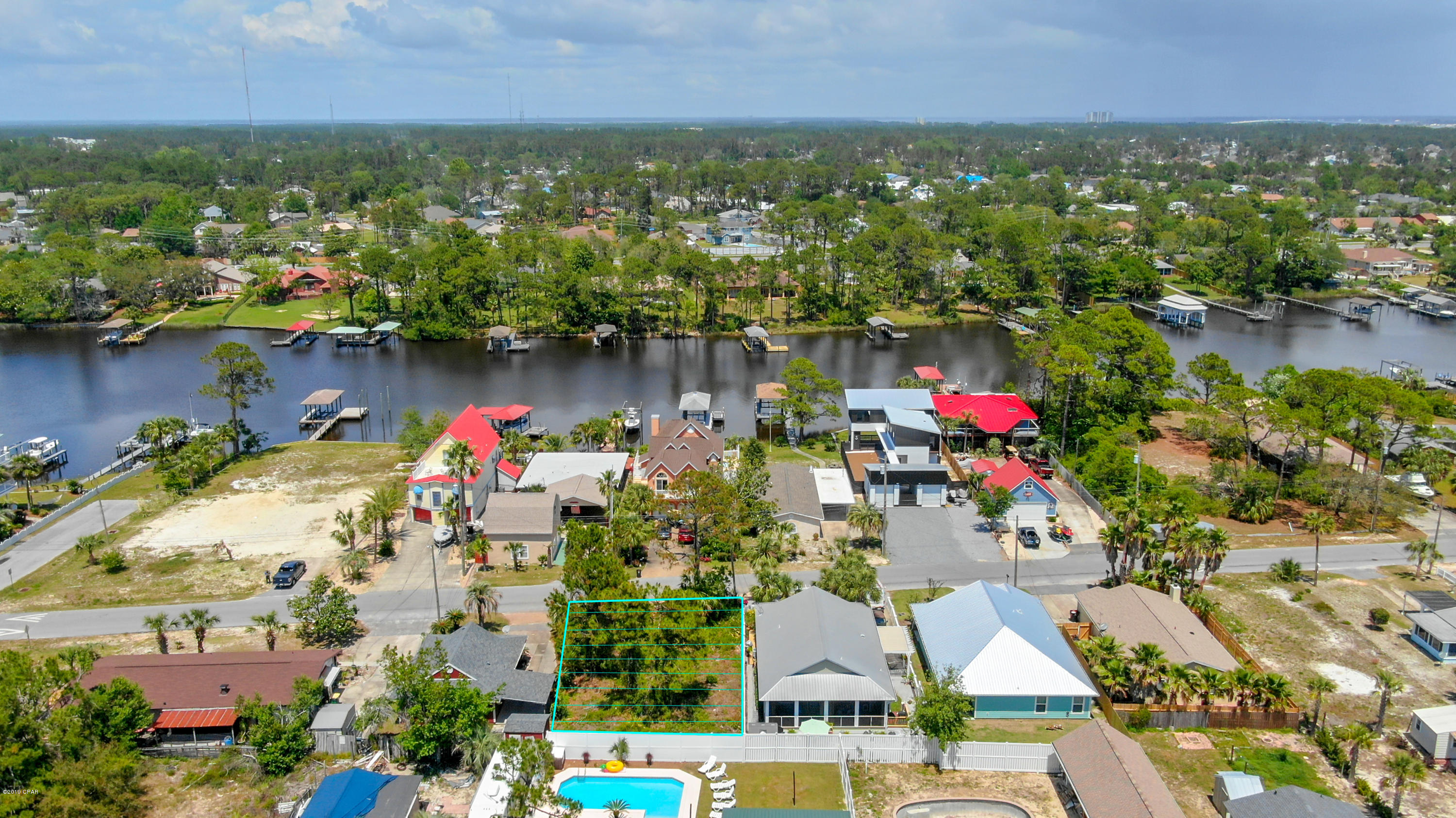 Water view on Grand Lagoon - This lot is in a great location on Lydia Lane on South Lagoon. It is a short walk to the beach from this property. There is a boat ramp in close proximity. Great location to build your dream home.