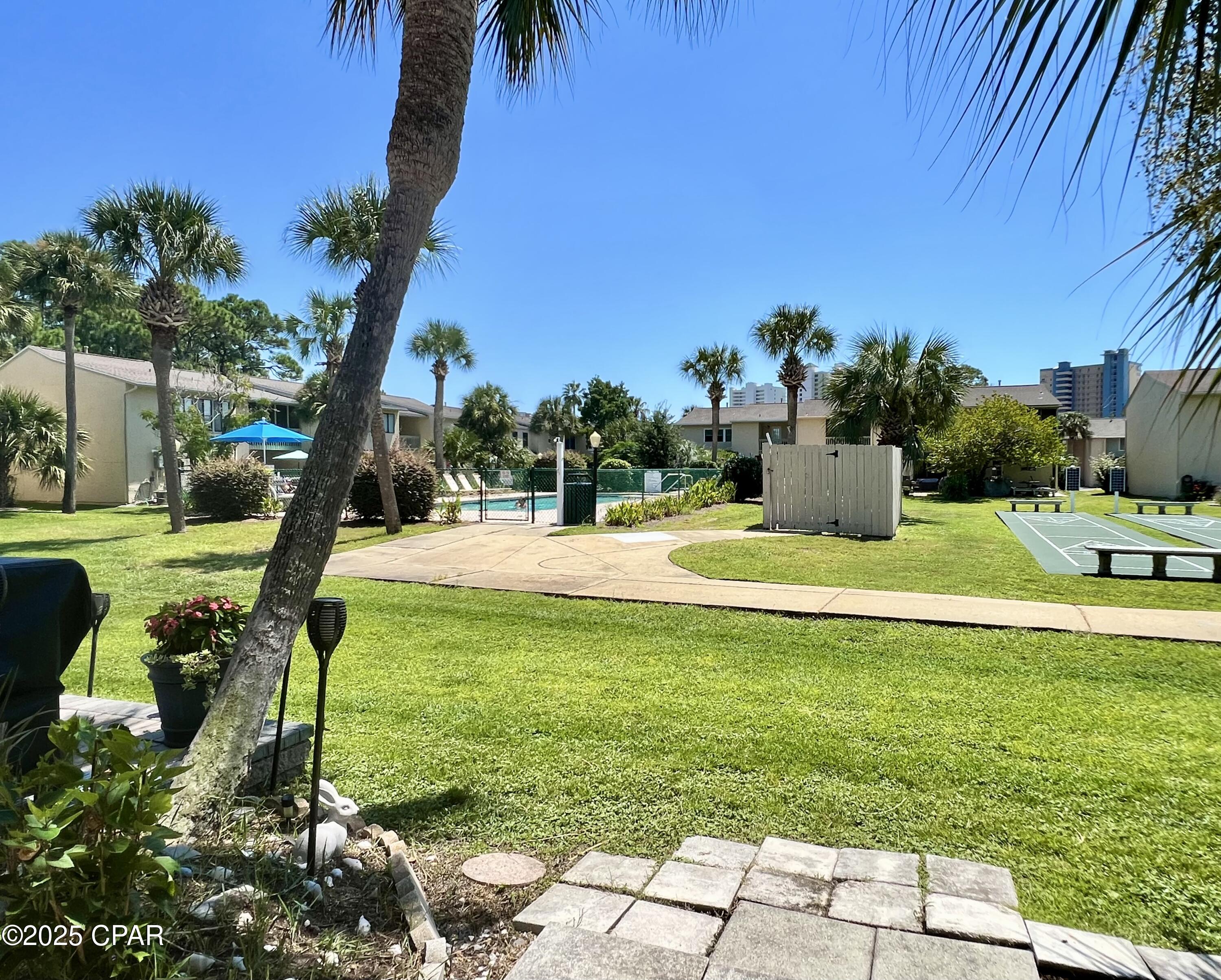 ATTENTION... NEW LOWER PRICE & NEW ROOF put on March 25th, 2026! This Glass back townhome is steps away from the pool, shuffleboard court and an 18-hole mini golf course. It is Turn-Key and move-in ready! Rental Ready certified, HVAC replaced in 3 1/2 years approx., all new smoke detectors, plumbing + newer disposal, new sofa and loveseat and curtains throughout, all new smart TV's perfect for streaming, newer side patio fence panel, patio brick upgrade, new blinds and a new front up glass door. This unit comes with two owners' closets and the two parking spaces are deeded to the unit.  This unit is super clean, bright & airy with nice decor & furniture. This open-concepts living area on the first floor creates a space that feels both open and more space that feels like a home. Upstairs, you will find two spacious bedrooms, each with its own full bathroom.  This unit is located in the sought after Gated Community of Gulf Highlands Beach Resort.  This complex offers the perfect blend of fun, comfort, style and convenience to shopping, restaurants, Water Park, entertainment, storage units, ER Dept/Walk in clinics, post office, and many more all within walking distance. As an owner, you have access to all of the amenities (11 pools, Mini Golf course, Shuffleboard/Pickle ball/Tennis courts, Playground areas, Private Beach House with Pool and Cafe, Private Beach access with Golf Cart parking across the street. This community is an incredible perk for beach lovers, investment opportunity, and location of this unit checks all the boxes. IF measurements, SF, and dimensions approximate, please verify if important.